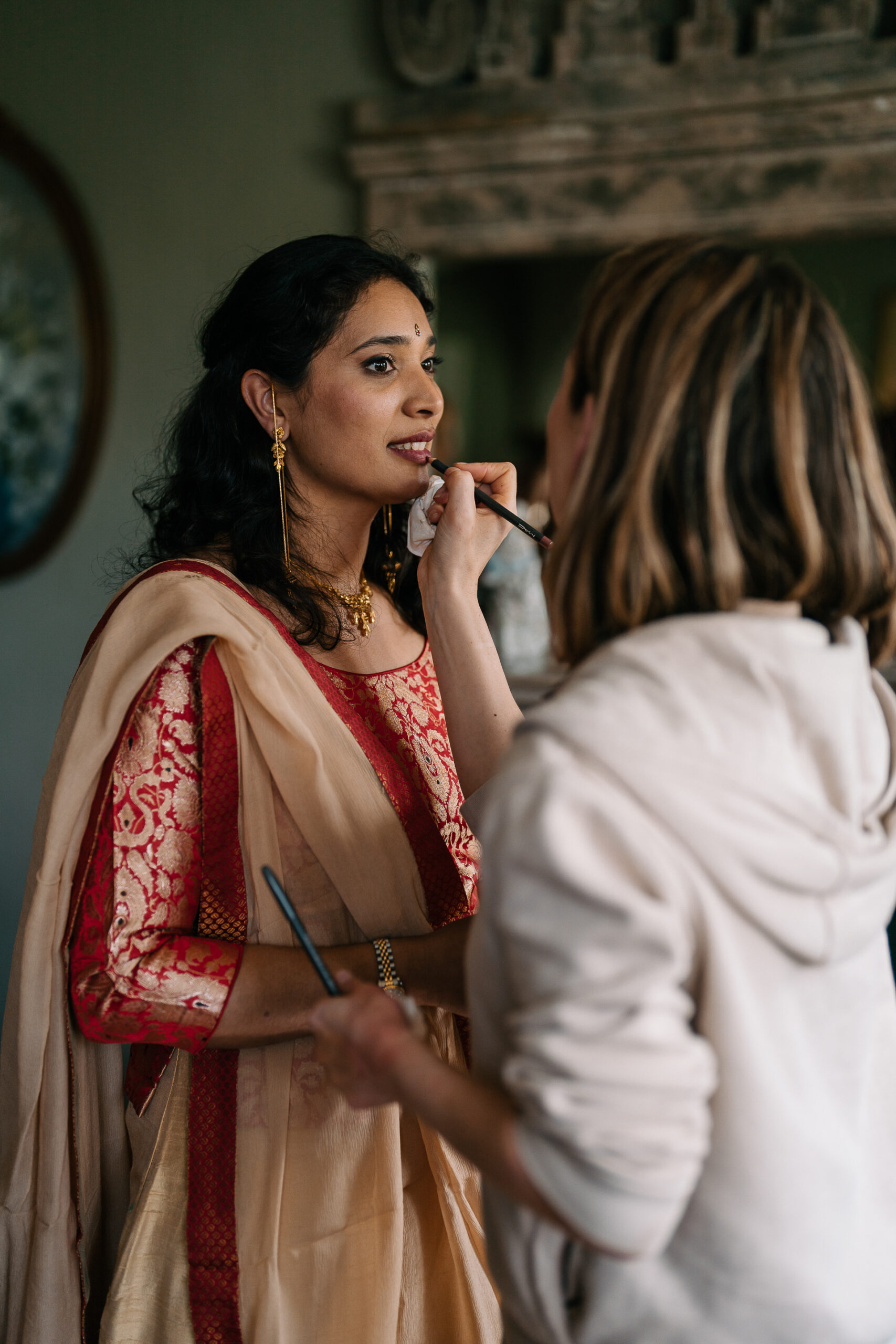 Indian bride getting ready for her wedding at Markree Castle during makeup application