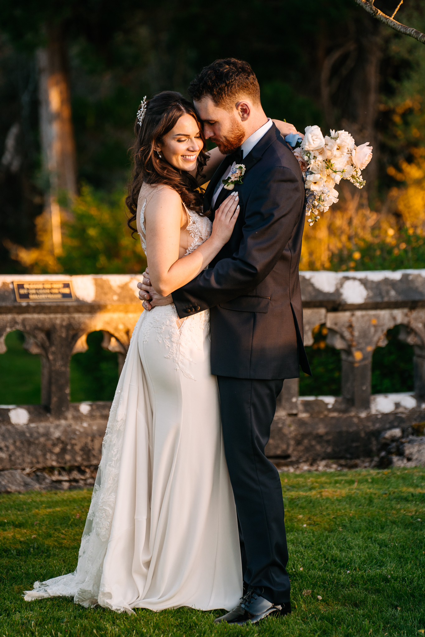 Bride and groom sharing a romantic sunset moment at Markree Castle – golden hour wedding portrait