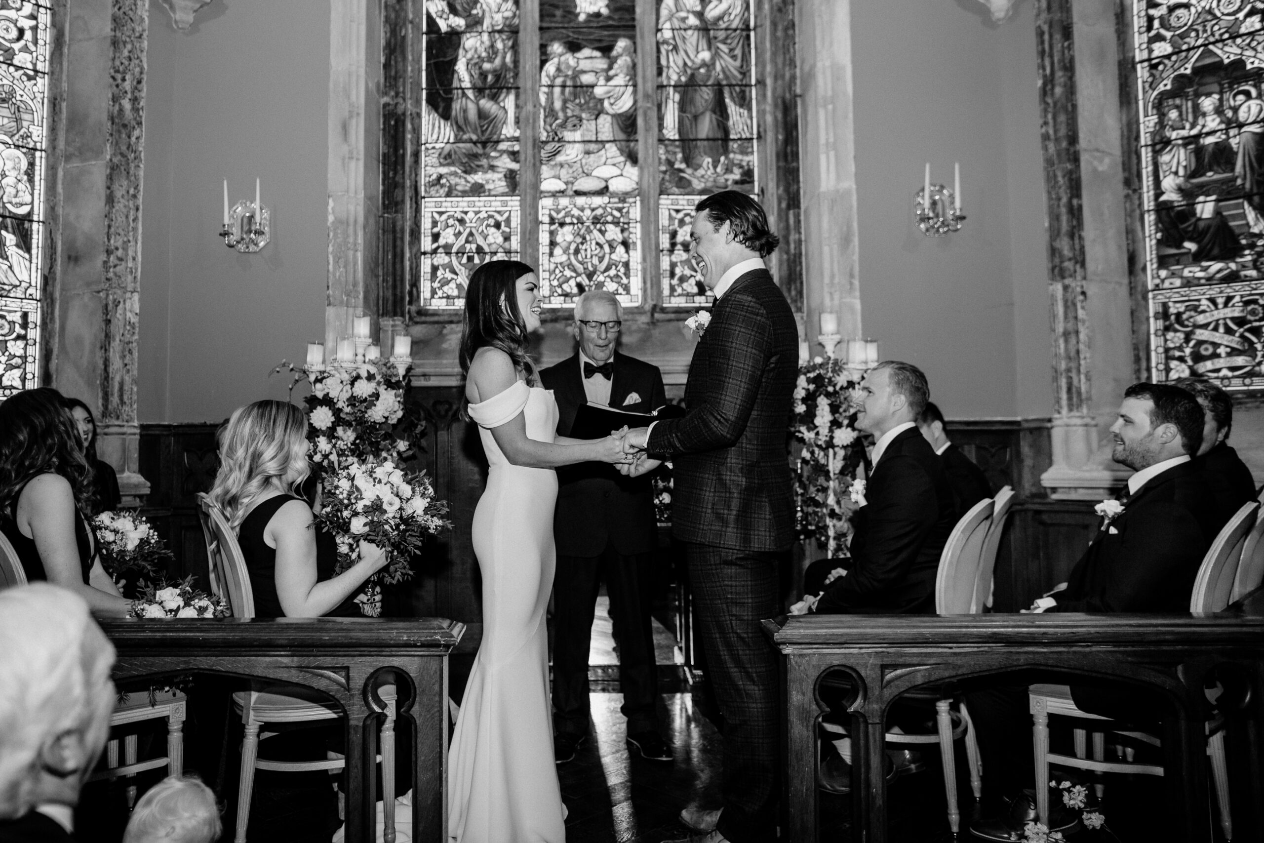 Bride and groom exchange vows during indoor wedding ceremony at Markree Castle chapel