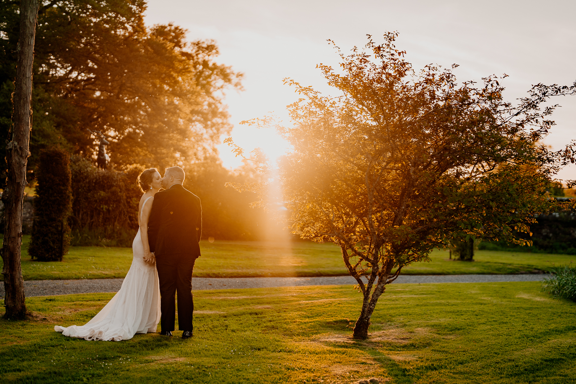 Sunset wedding portrait of the couple at Markree Castle in the garden.