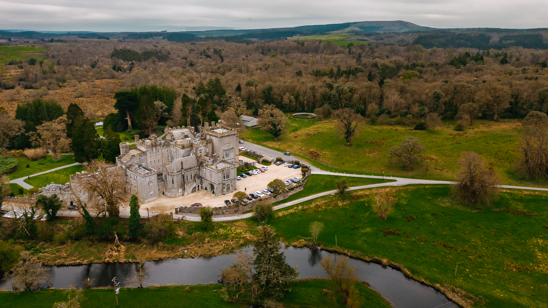 Drone photo of Markree Castle surrounded by lush Irish countryside and forest, captured during an Indian destination wedding

