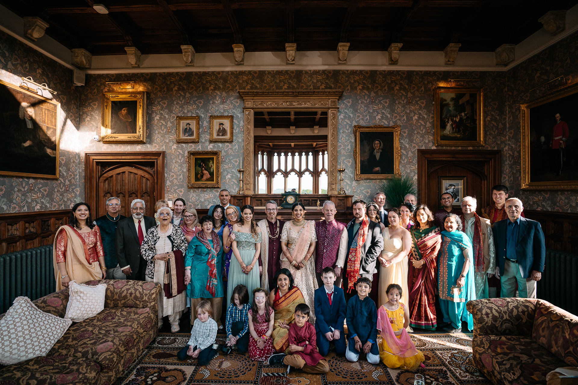 Family group portrait in the Billiard Room at Markree Castle during an Indian wedding