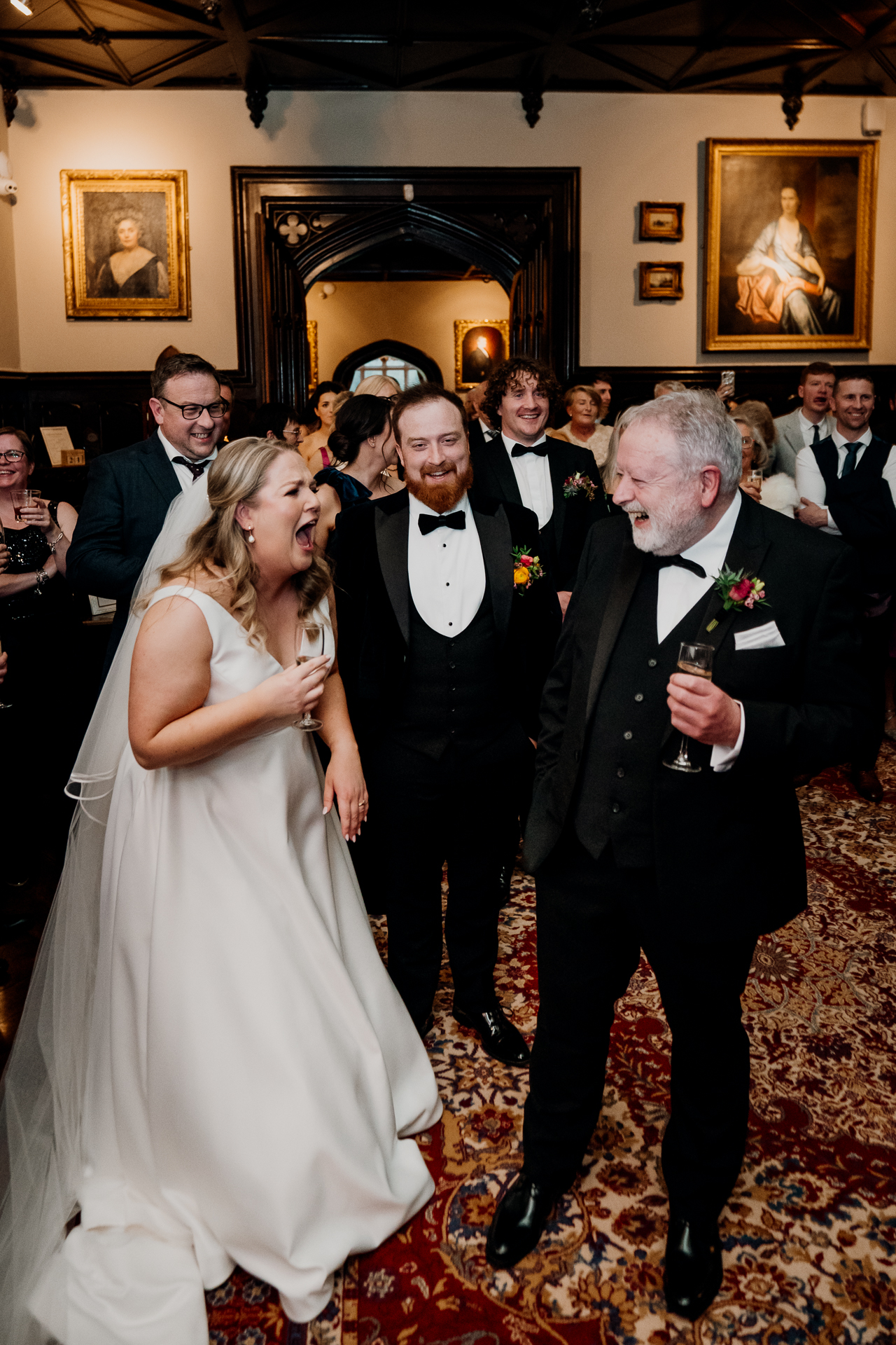 Bride and her father sharing a joyful moment during the wedding reception at Markree Castle