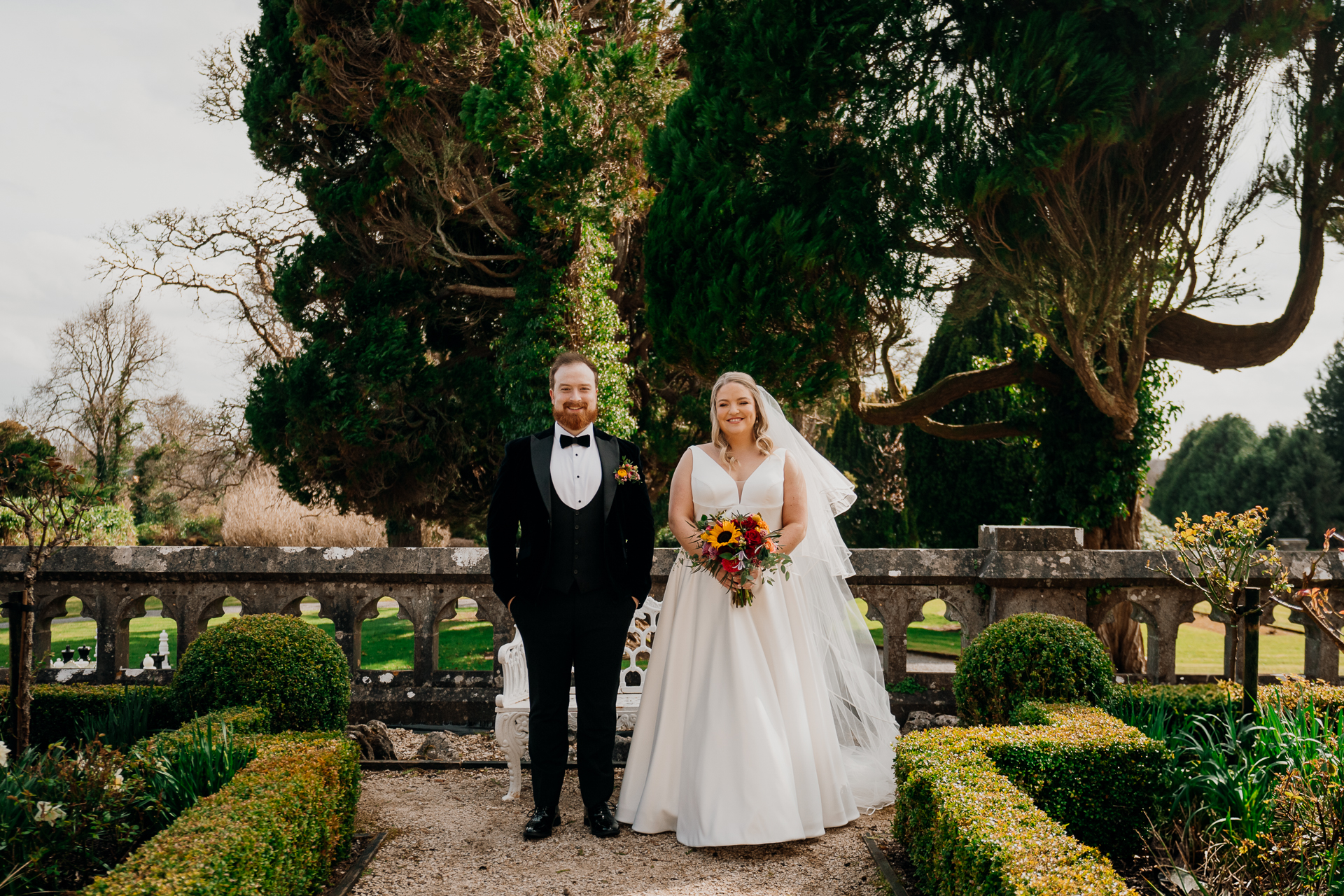 Bride and groom walking in the garden at Markree Castle during a spring wedding