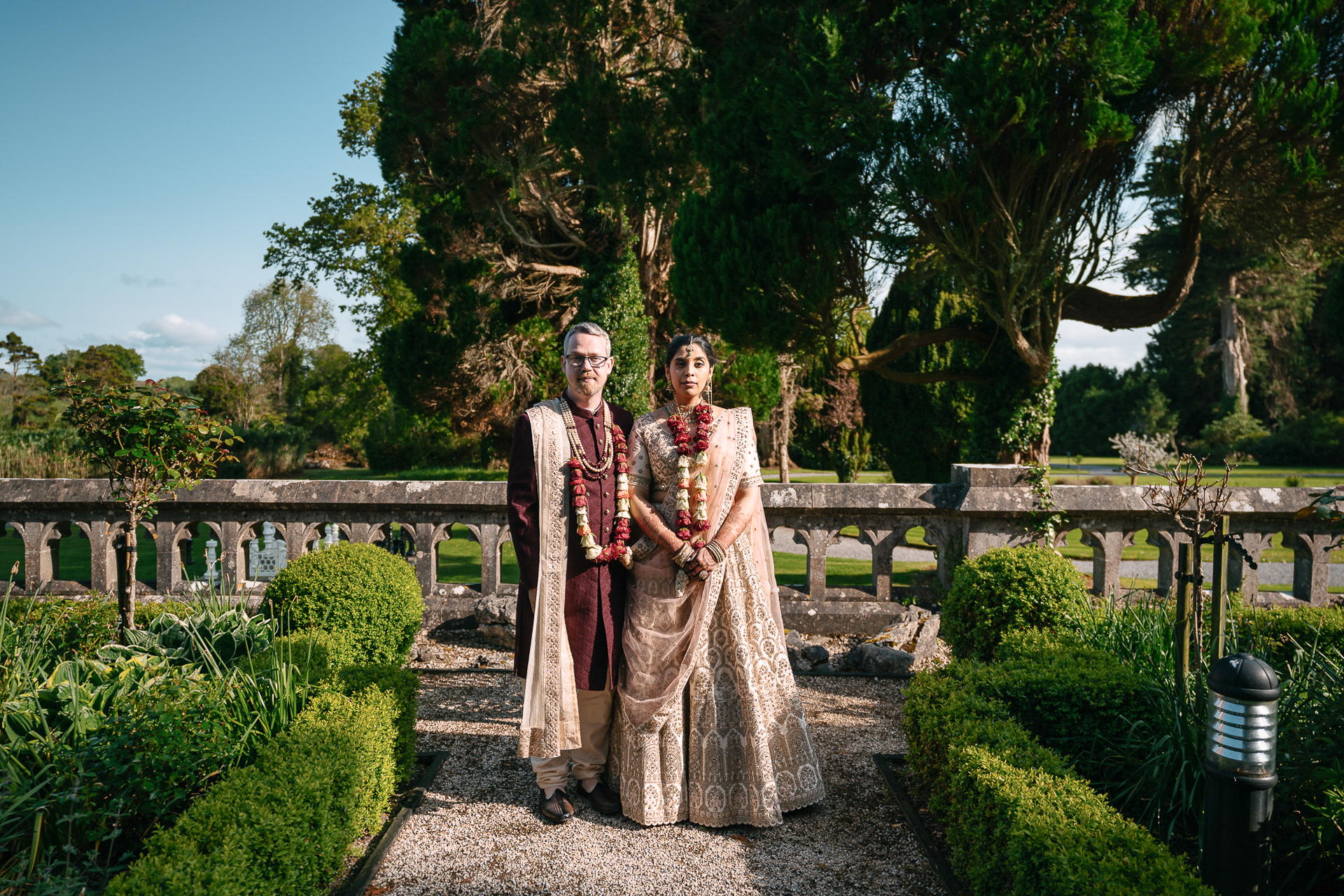Indian wedding couple posing in the gardens of Markree Castle during a summer celebration