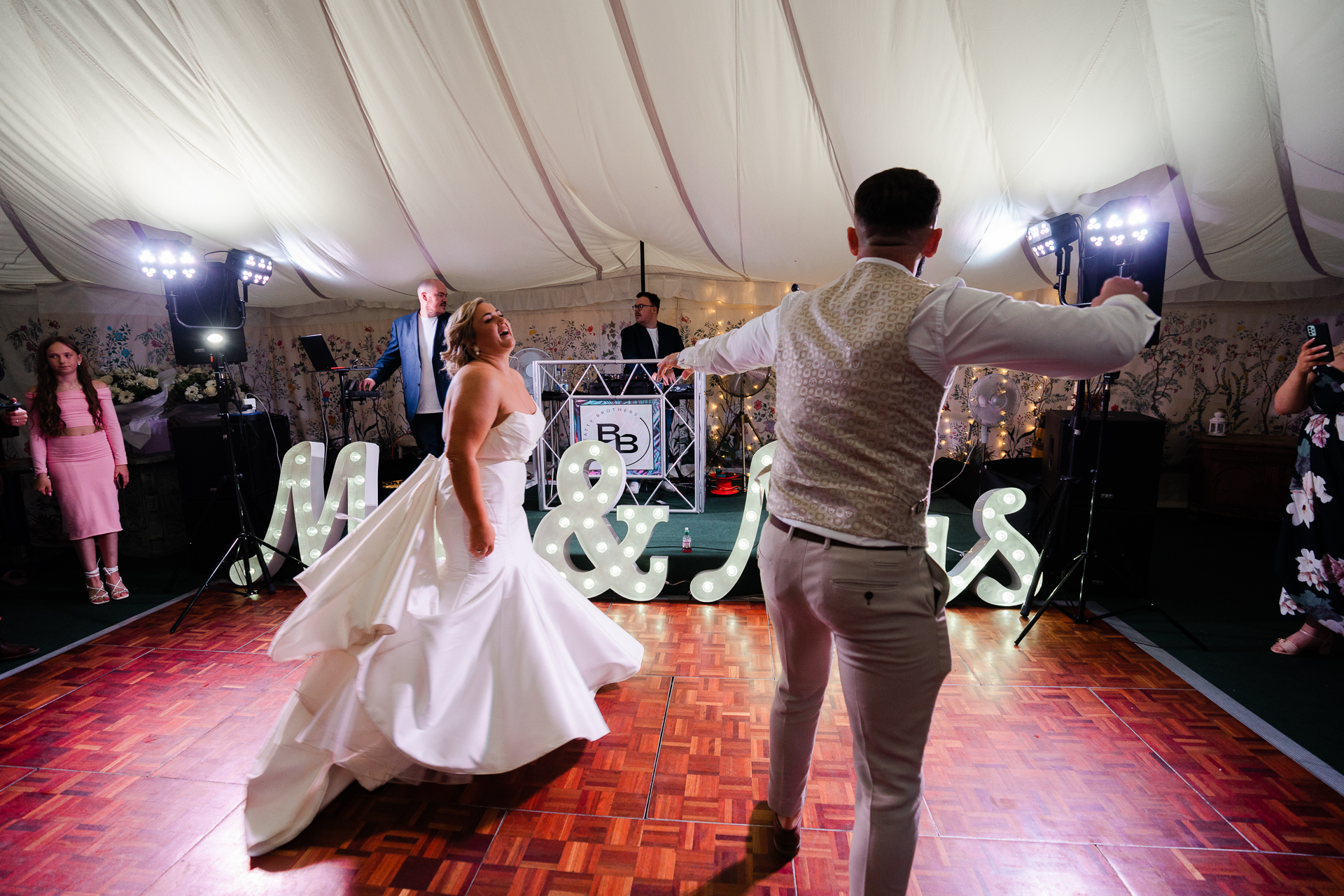 Bride and groom dancing during their first dance inside the Martinstown House marquee
