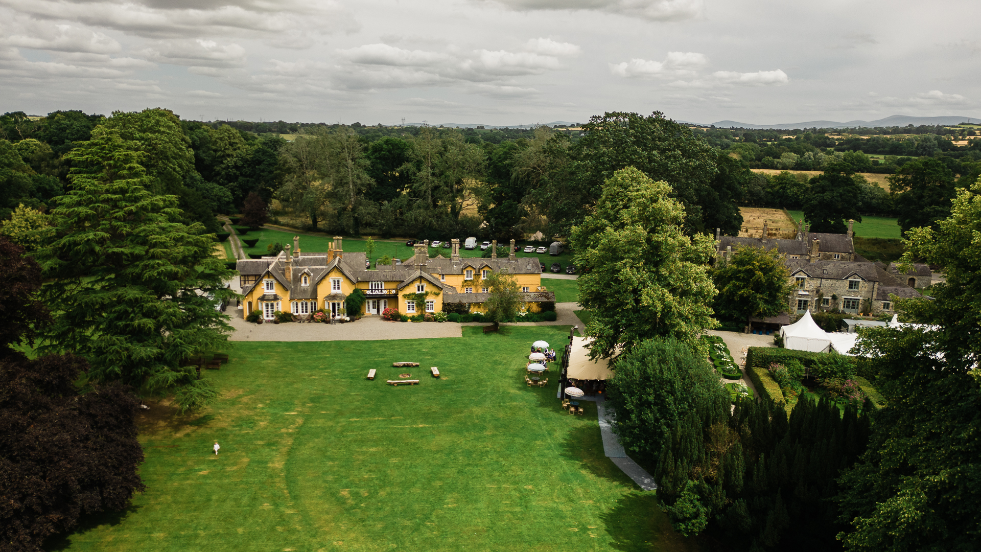 Aerial view of Martinstown House wedding venue in Ireland surrounded by greenery – perfect for relaxed outdoor weddings