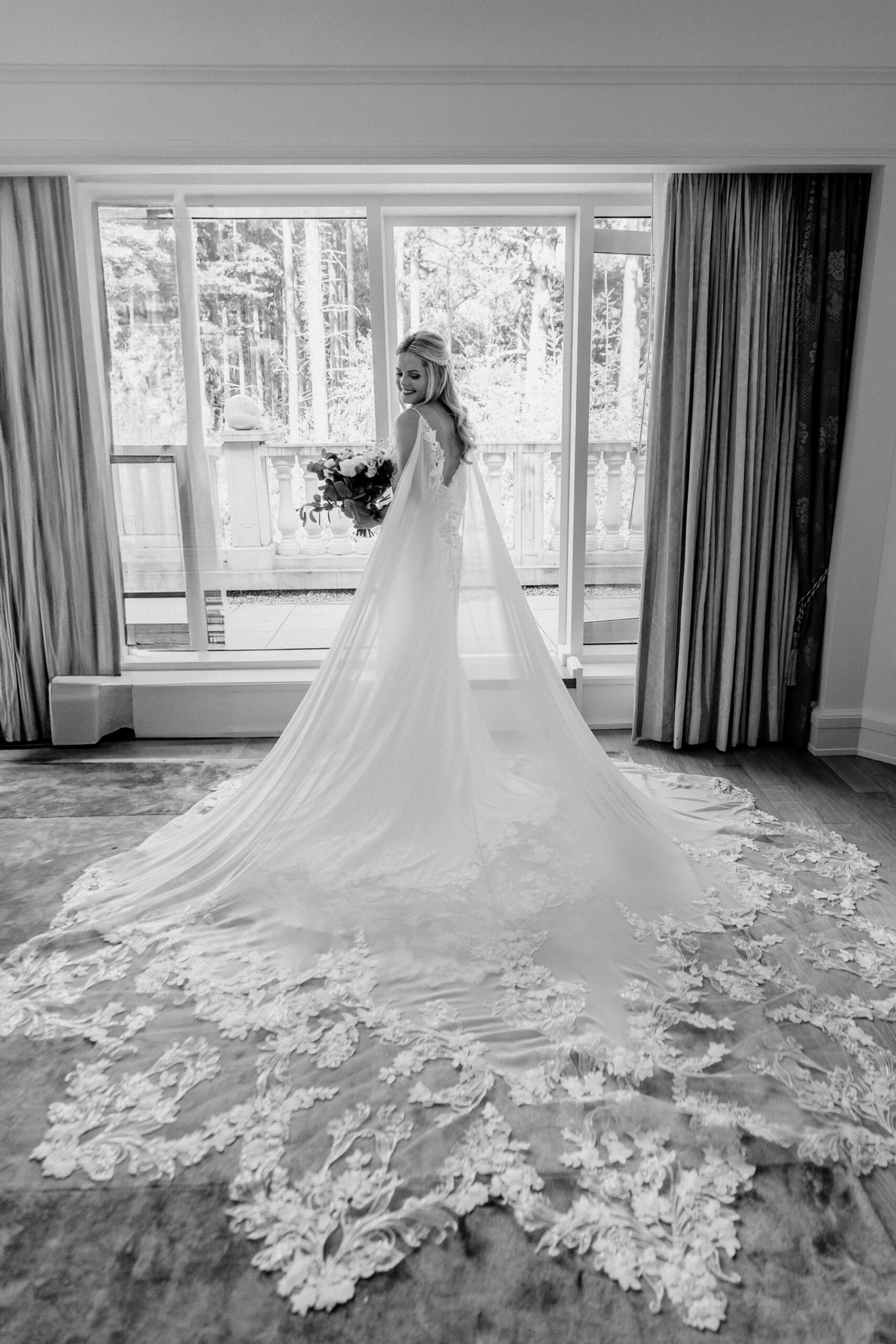 Black and white bridal portrait in the window light at Powerscourt House by a Dublin Wedding Photographer
