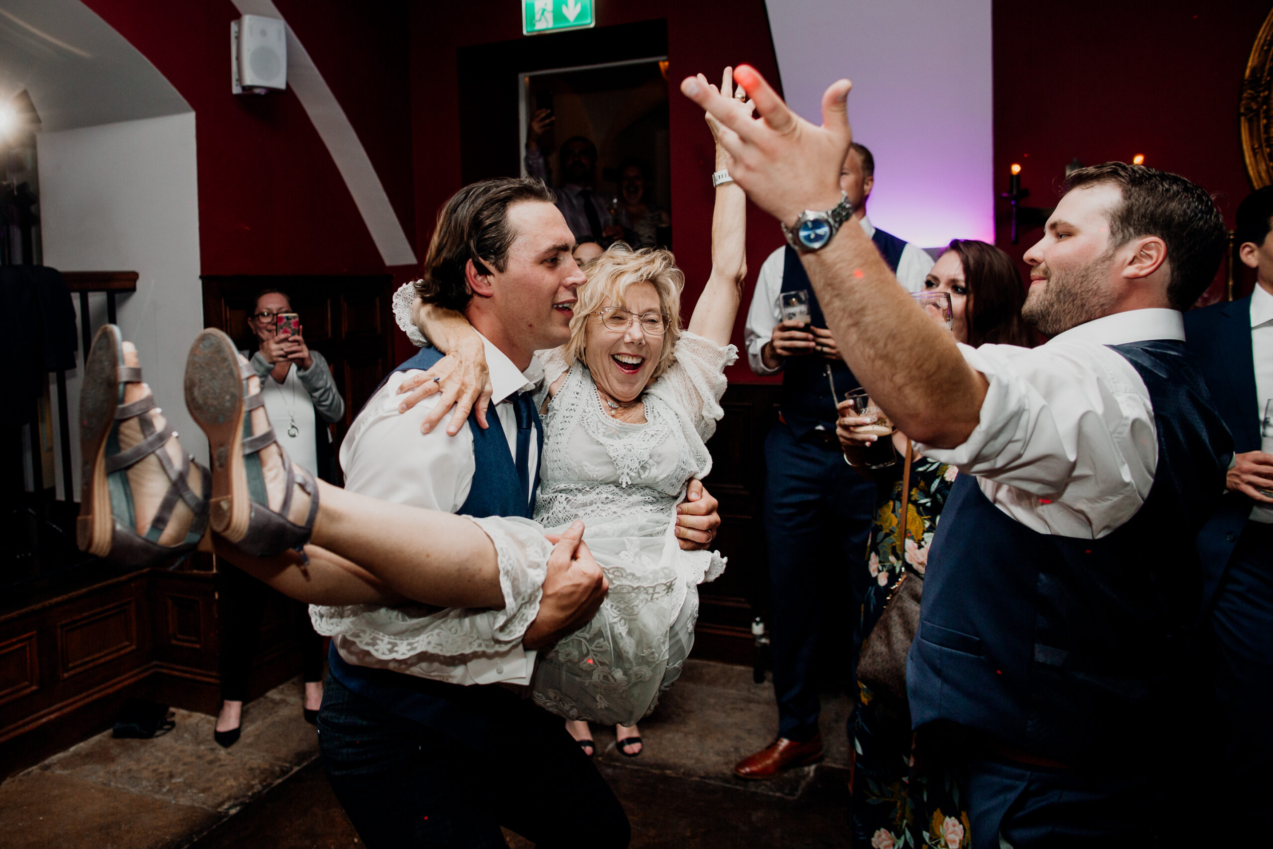 Wedding guests dancing and laughing during the reception at Markree Castle