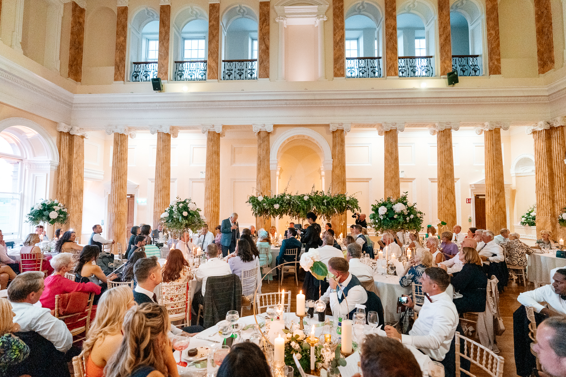 Wedding guests enjoying the reception at Powerscourt House, captured by a Dublin Wedding Photographer during a luxury destination celebration