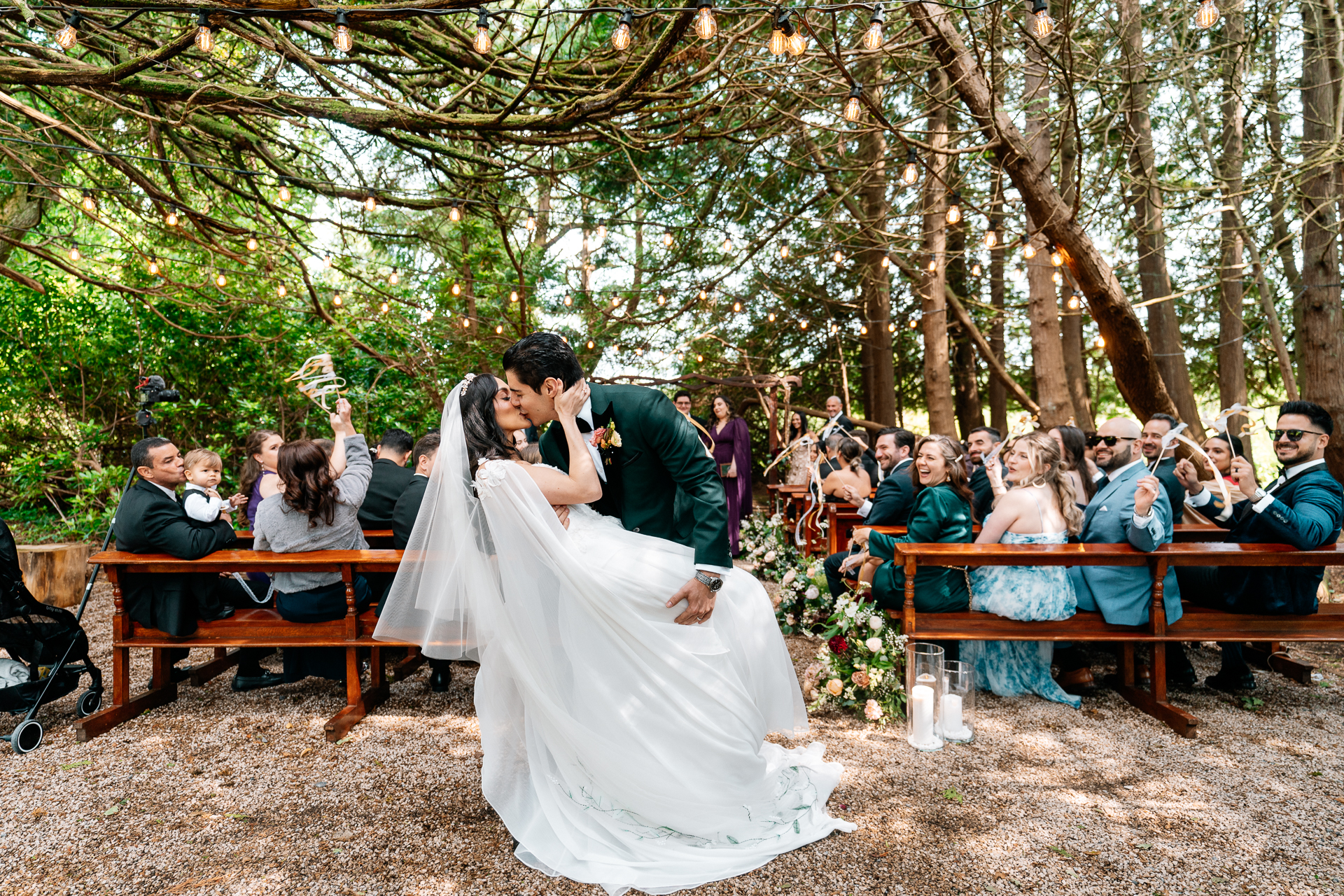 Bride and groom sharing their first kiss after garden wedding ceremony at Markree Castle

