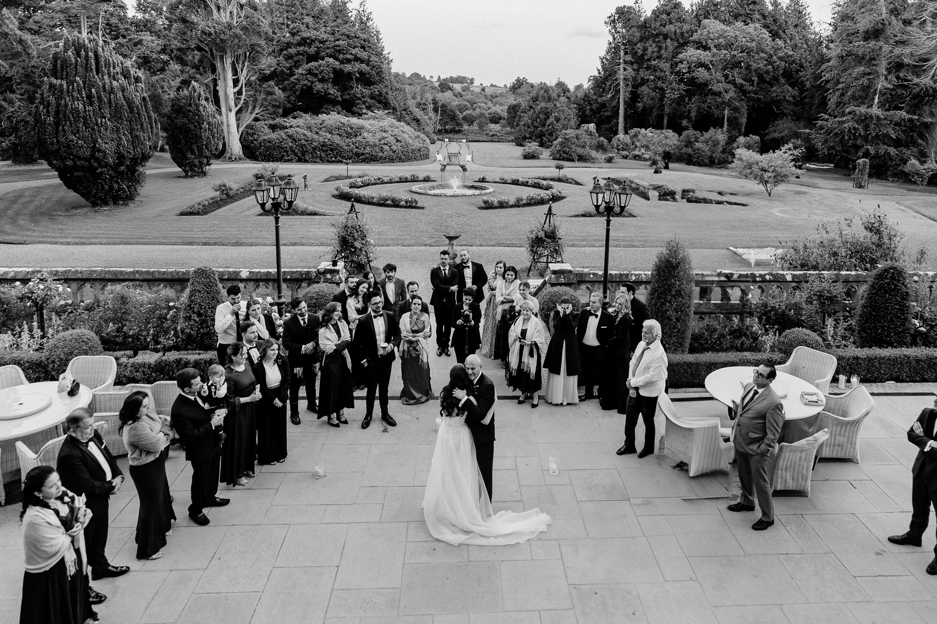 First dance on the garden terrace at Markree Castle with guests watching in the background