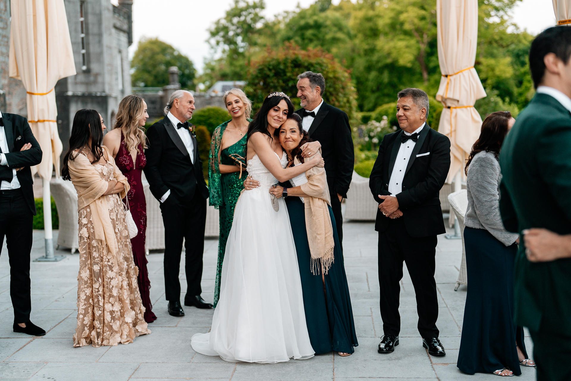 Bride and groom sharing their first dance on the garden terrace of Markree Castle under twinkling lights
