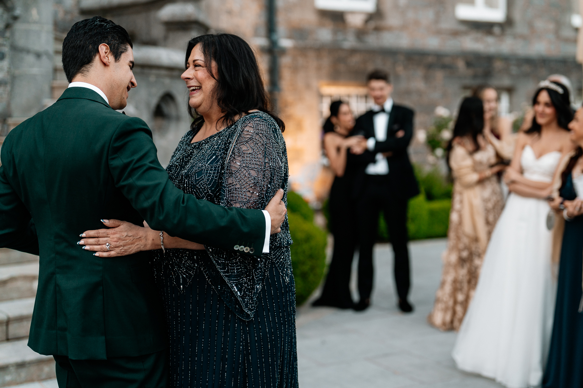 Bride and groom sharing their first dance on the garden terrace of Markree Castle under twinkling lights