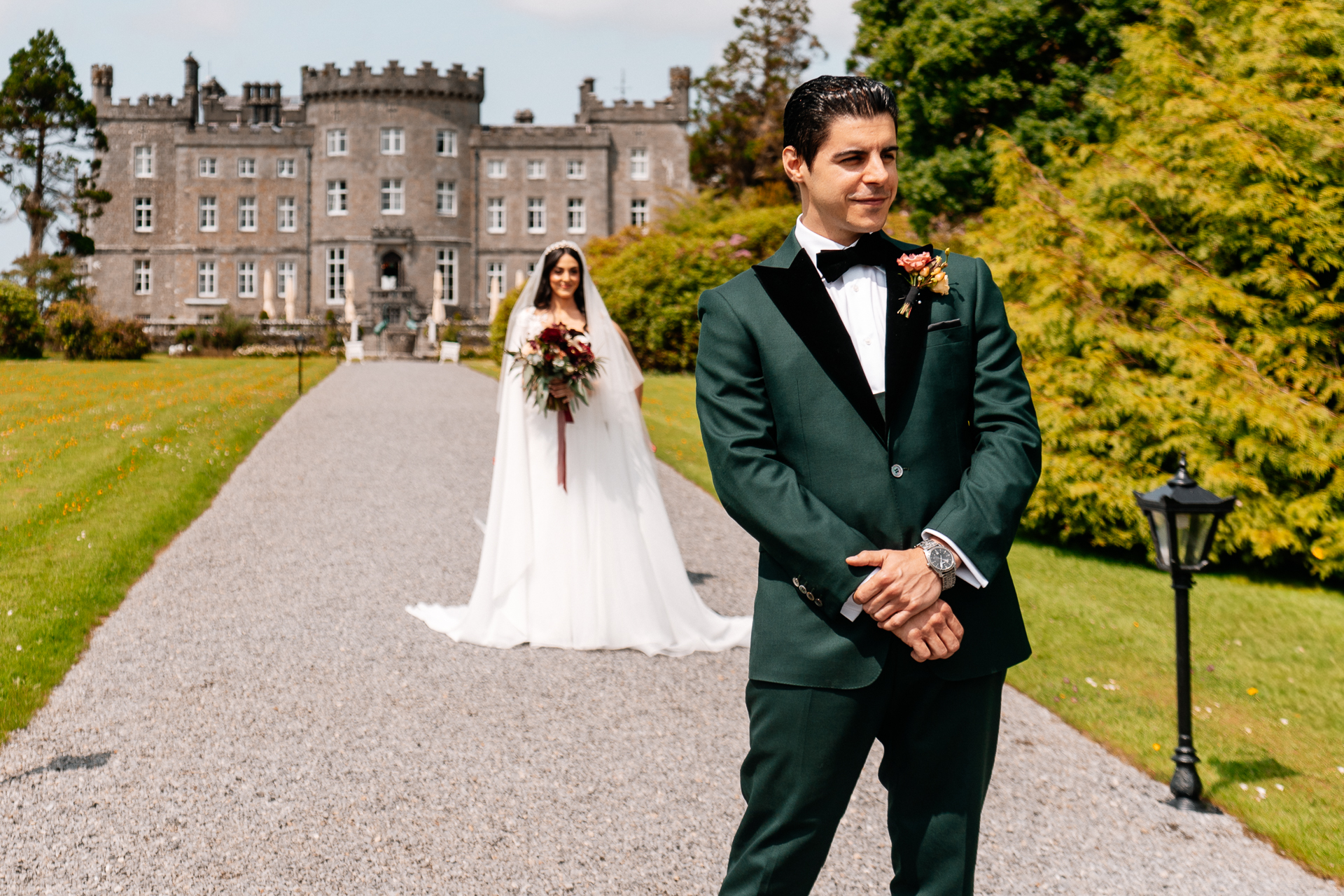 Bride and groom seeing each other for the first time during a first look by the river at Markree Castle