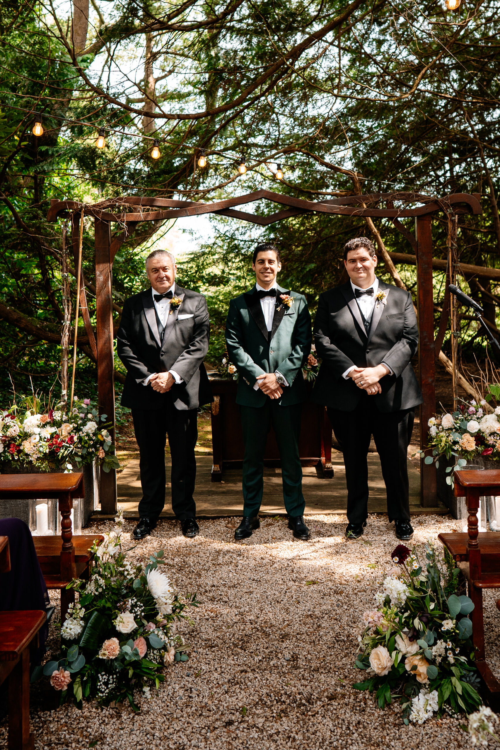 Bride and groom exchanging vows during a woodland ceremony in the forest clearing at Markree Castle