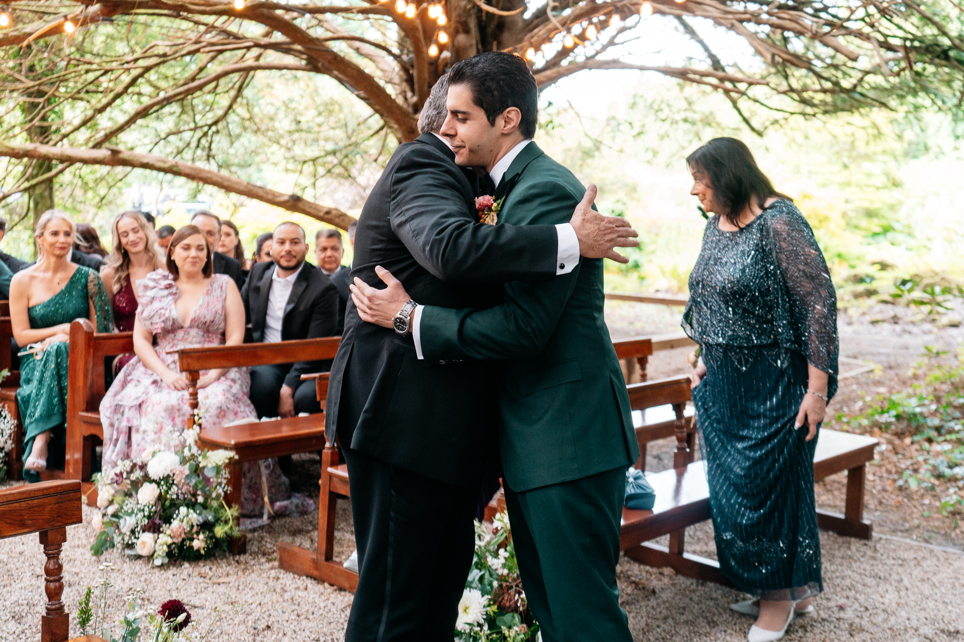 Bride and groom exchanging vows during a woodland ceremony in the forest clearing at Markree Castle