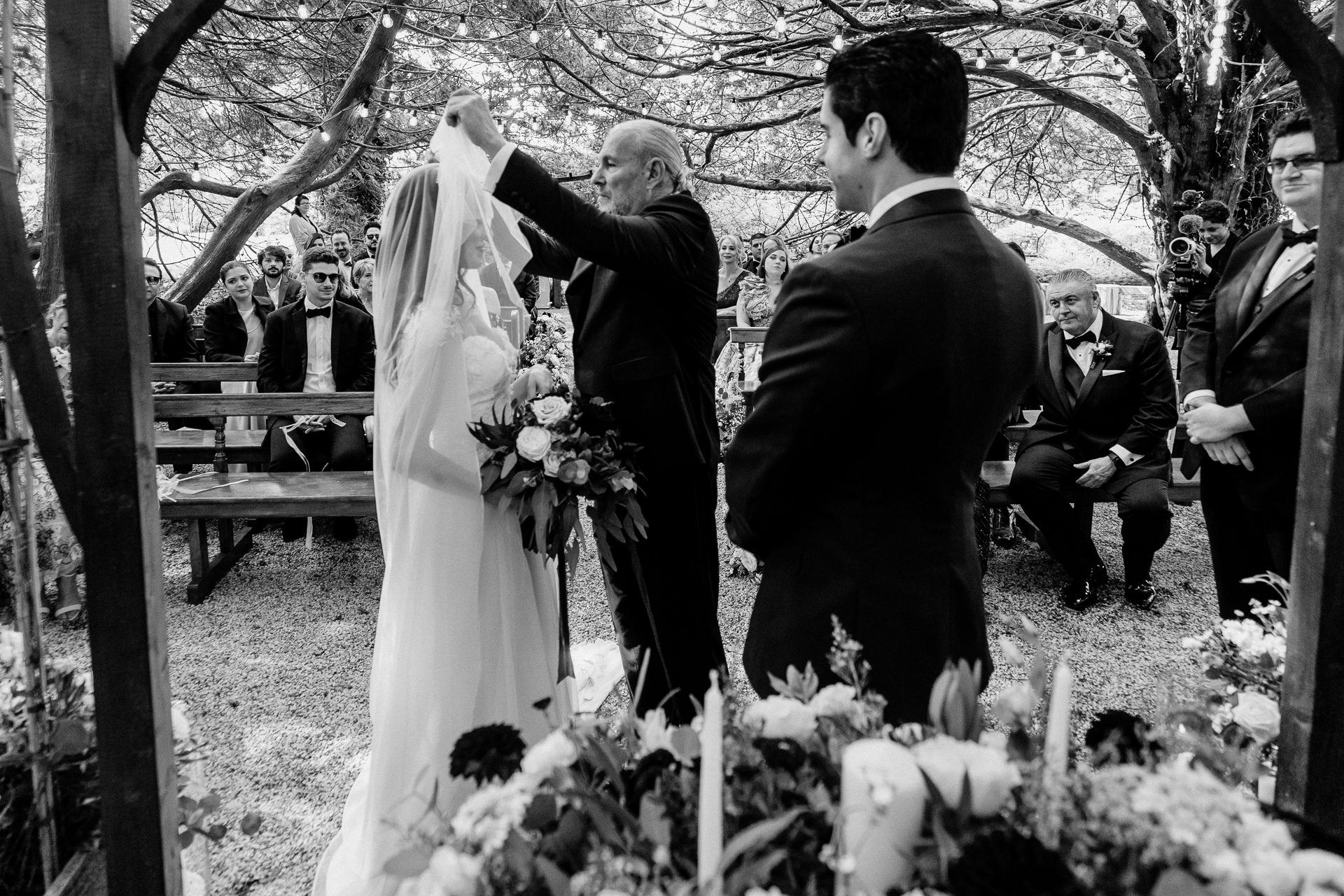 Bride and groom exchanging vows during a woodland ceremony in the forest clearing at Markree Castle