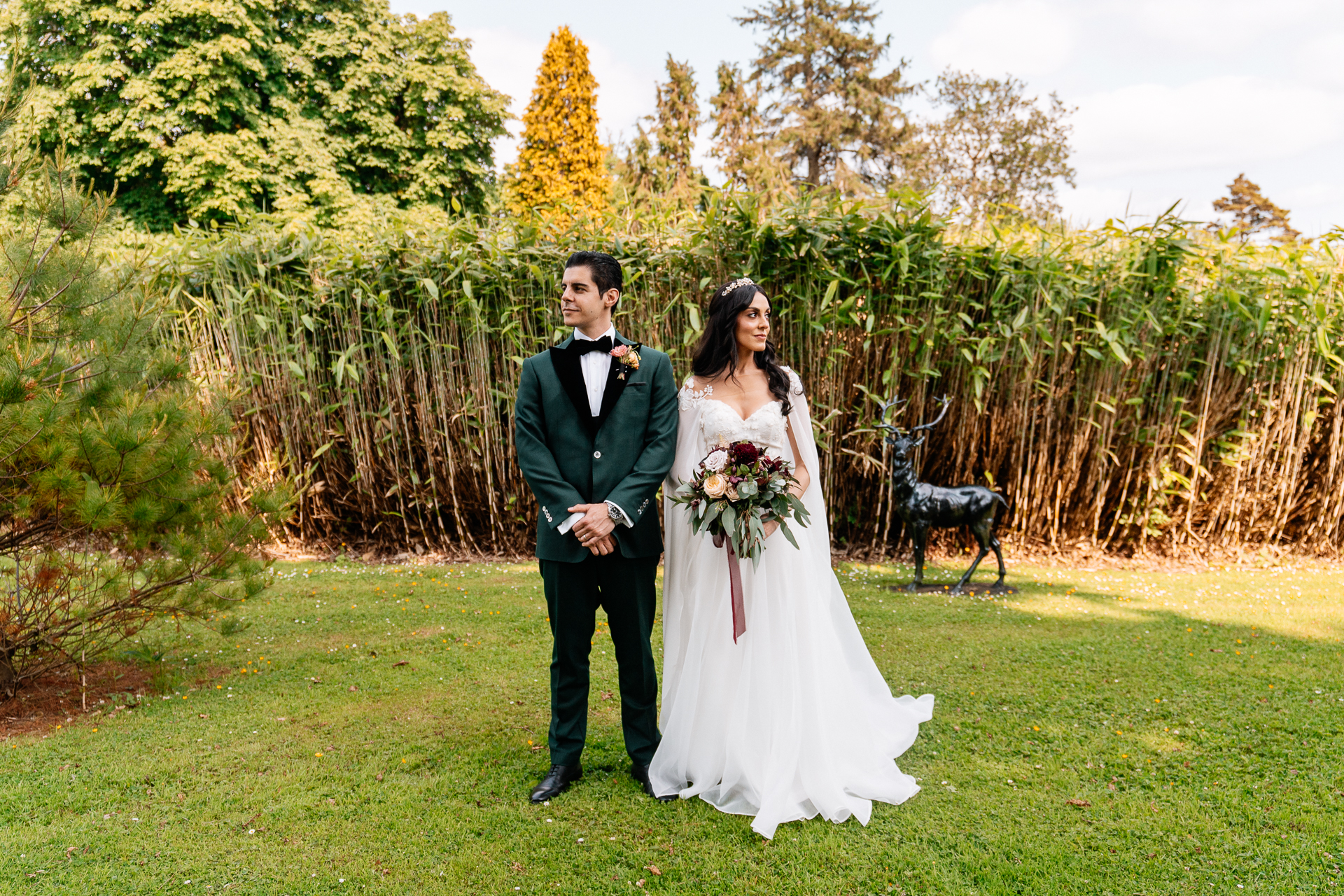 Bride and groom walking through the gardens of Markree Castle during their wedding portrait session