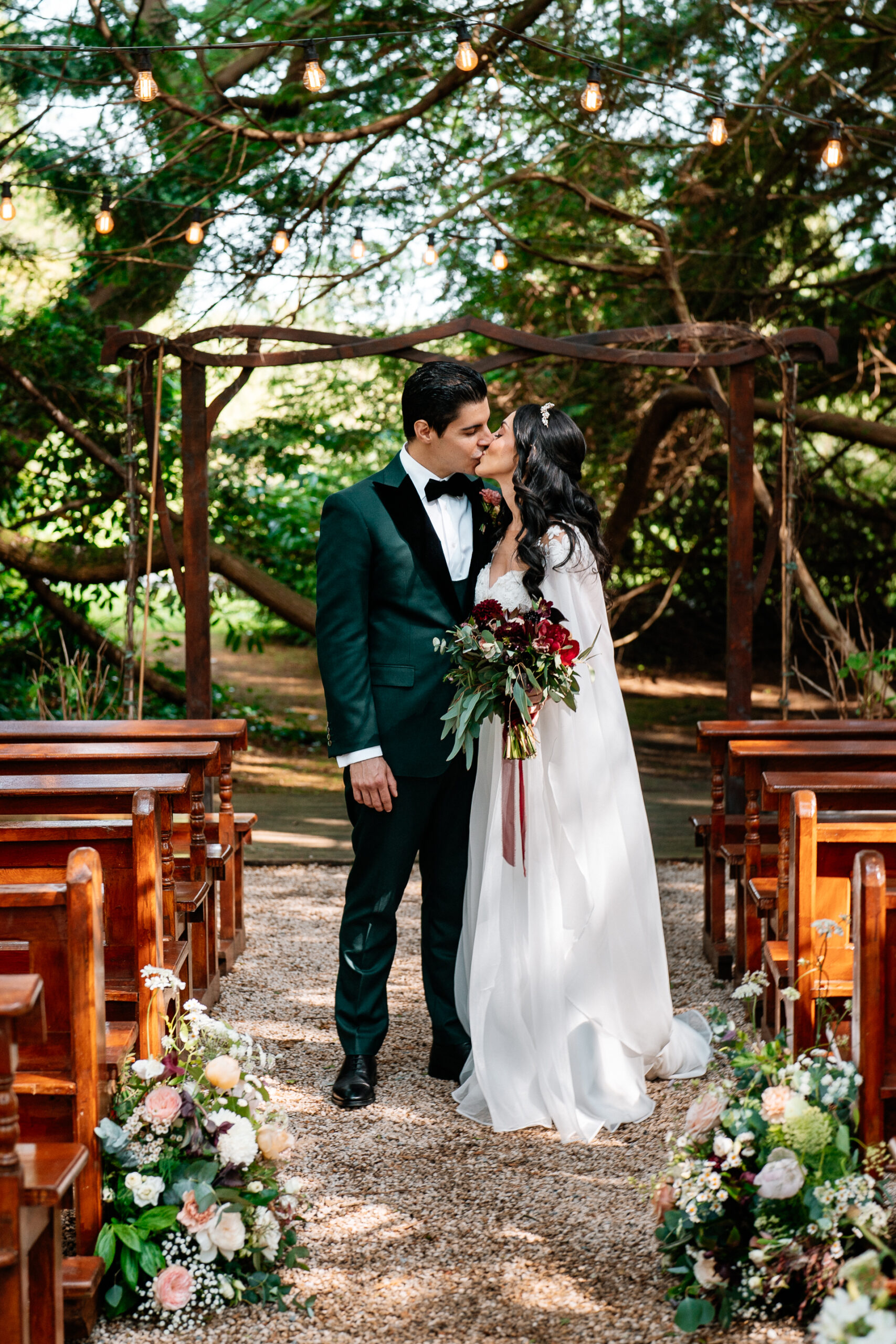 Bride and groom walking through the gardens of Markree Castle during their wedding portrait session