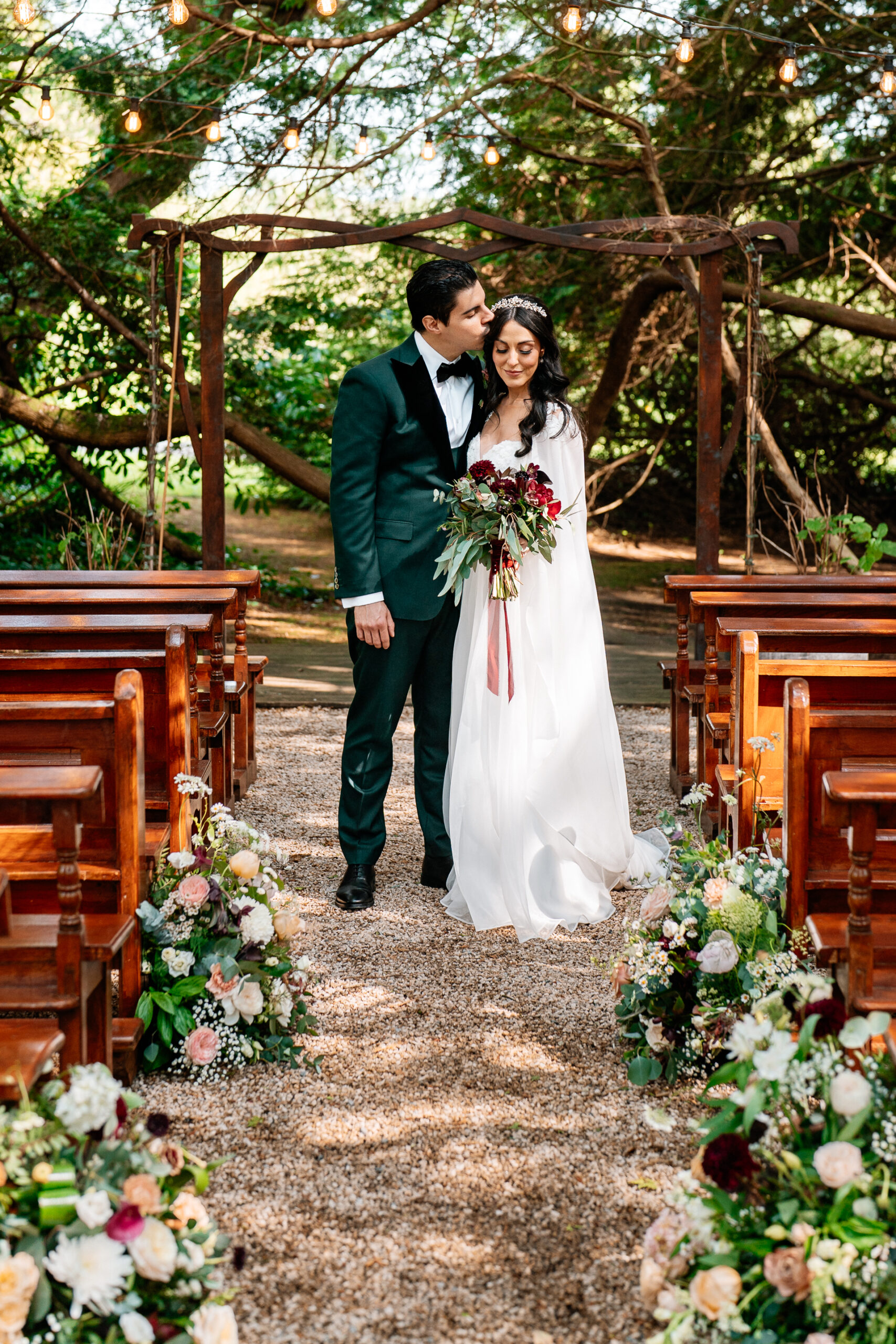 Bride and groom walking through the gardens of Markree Castle during their wedding portrait session
