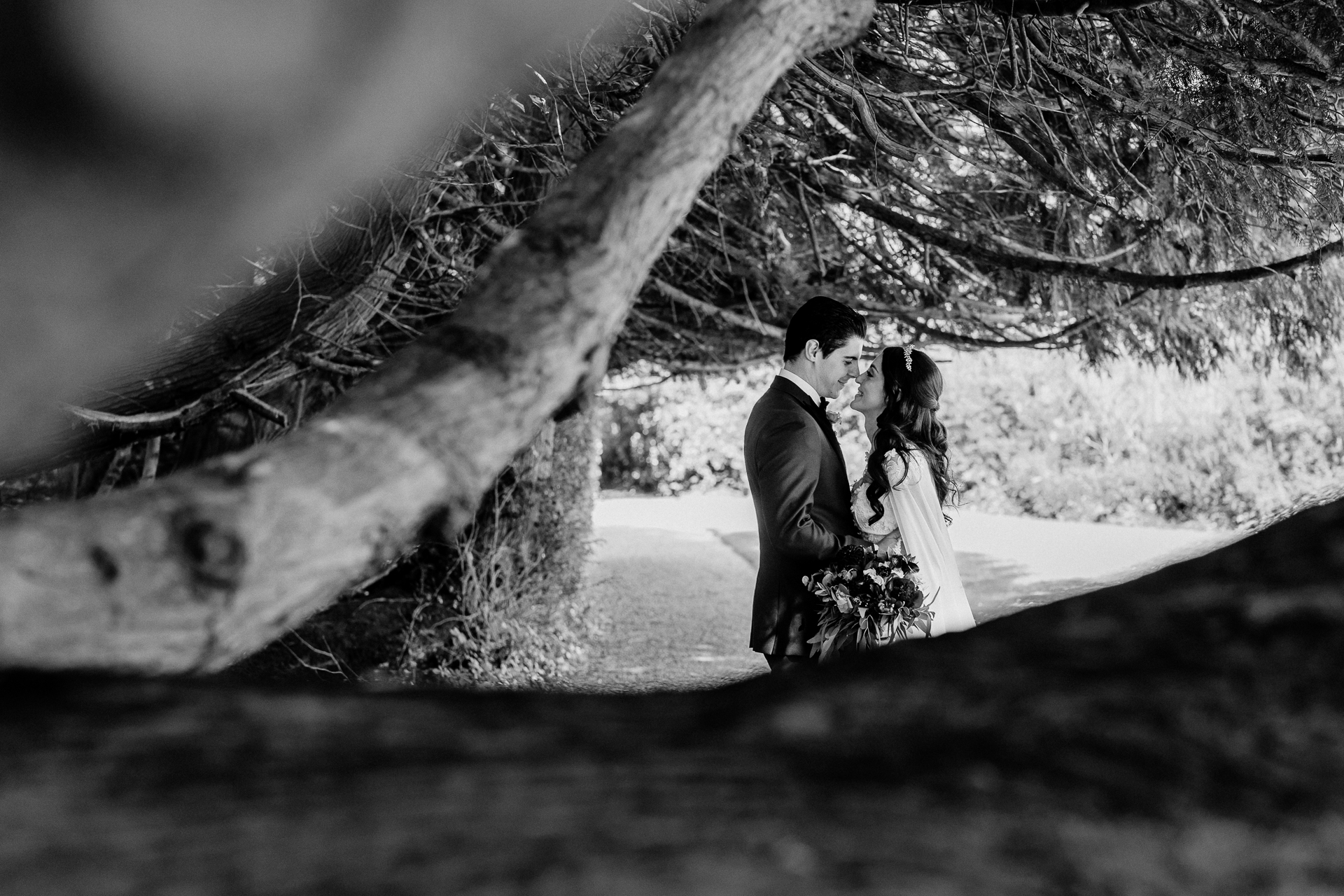 Bride and groom walking through the gardens of Markree Castle during their wedding portrait session