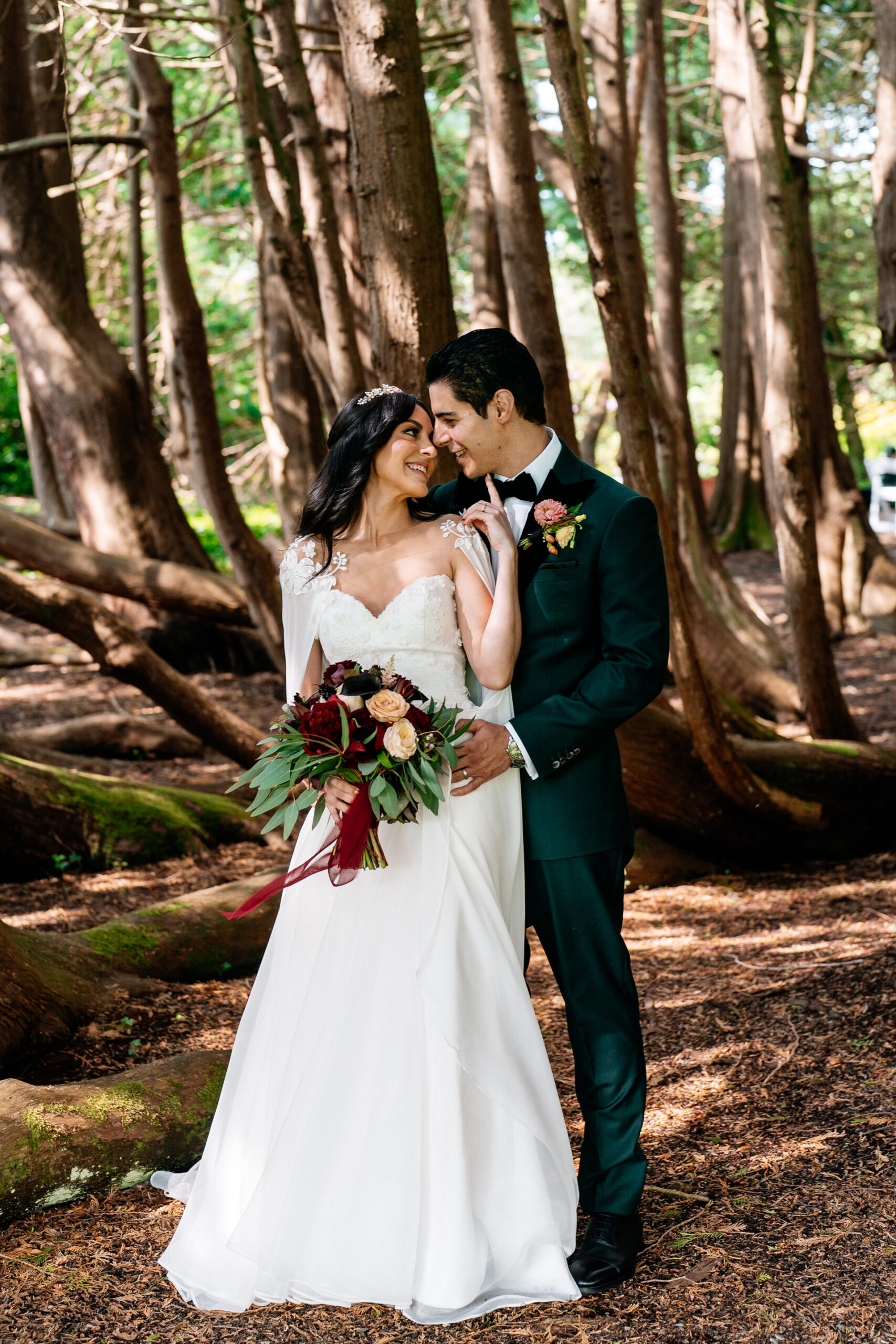Bride and groom walking through the gardens of Markree Castle during their wedding portrait session