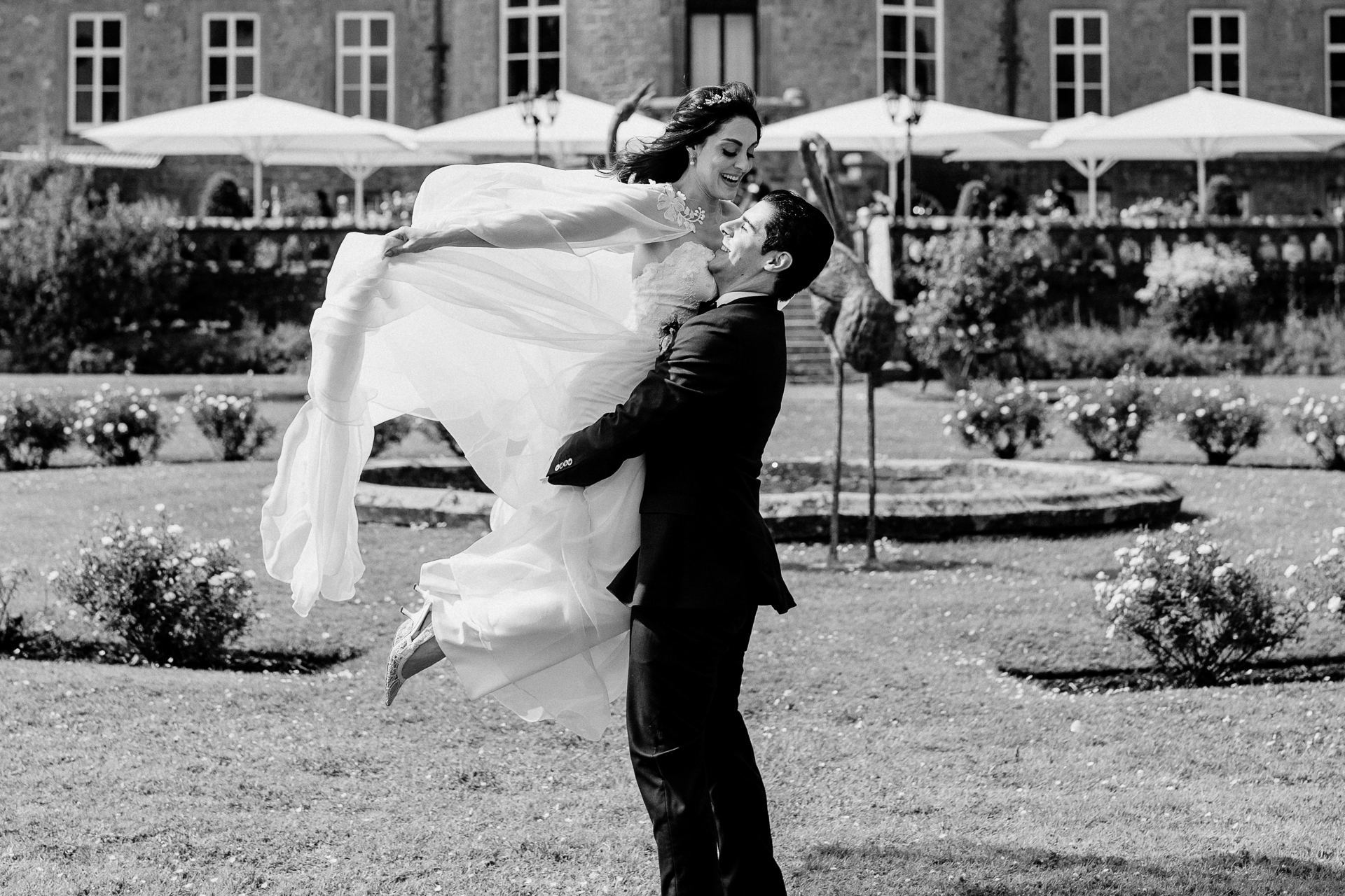 Bride and groom walking through the gardens of Markree Castle during their wedding portrait session