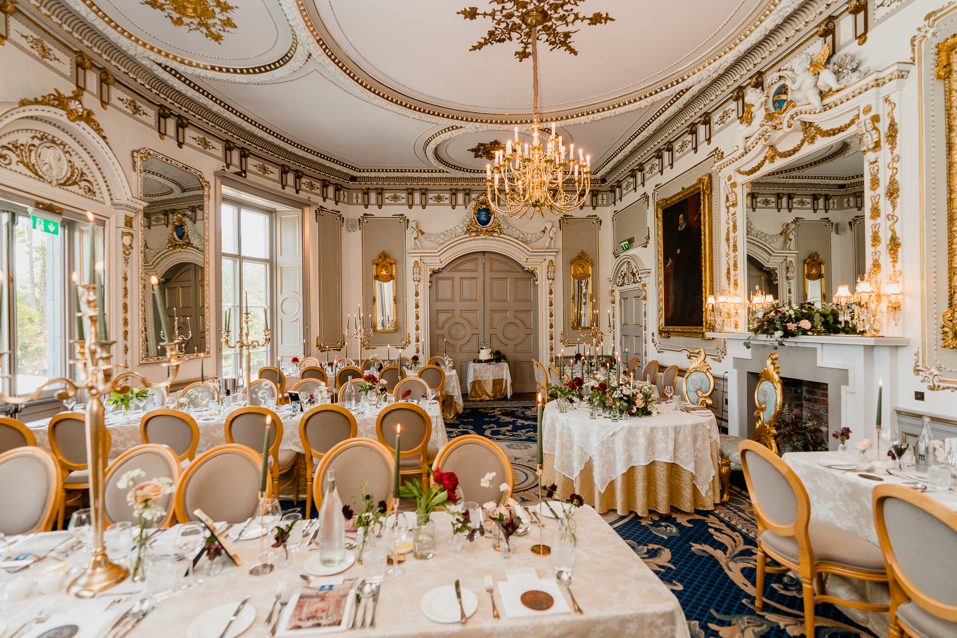Wedding dining room setup at Markree Castle with long tables and elegant decor