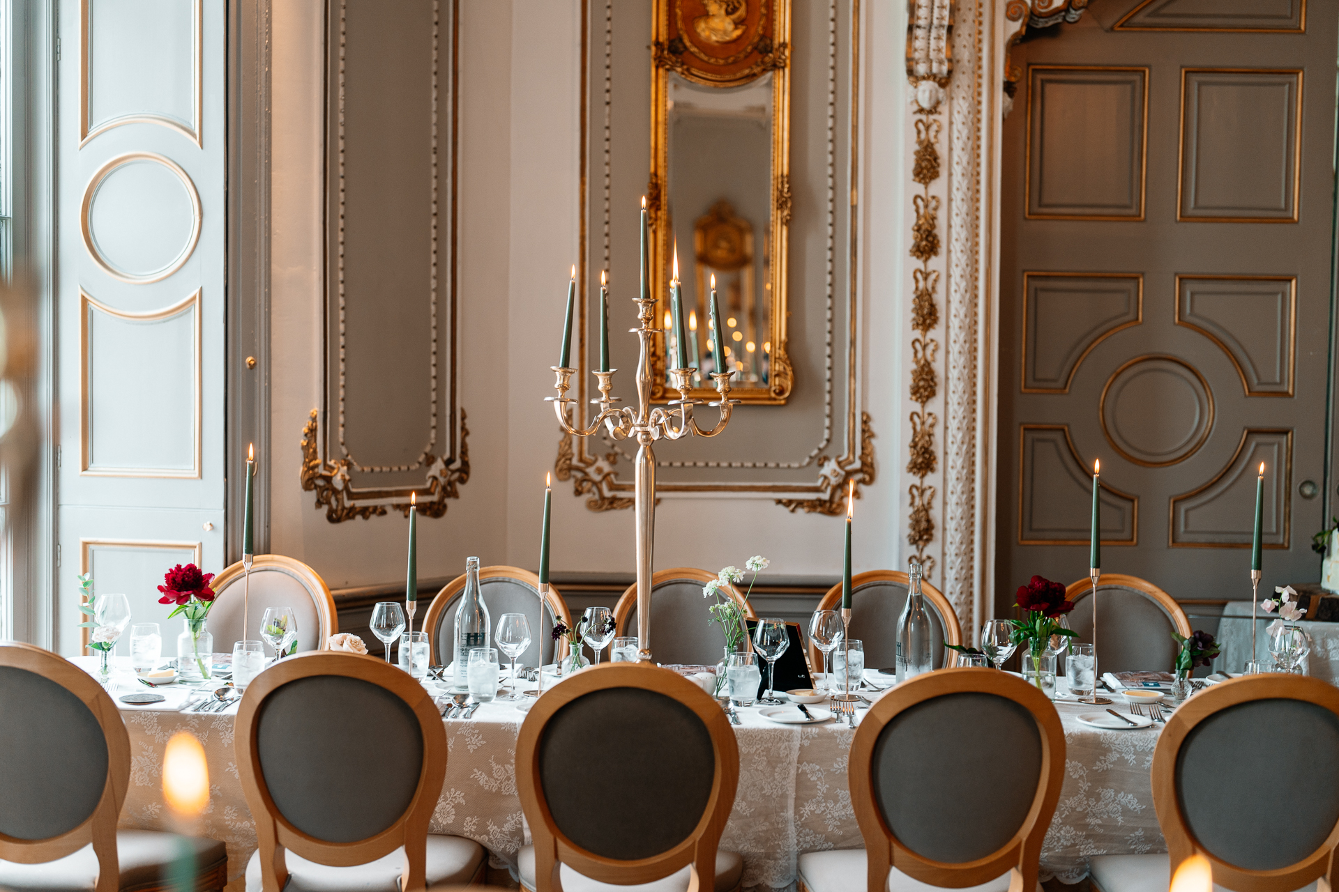 Wedding dining room setup at Markree Castle with long tables and elegant decor