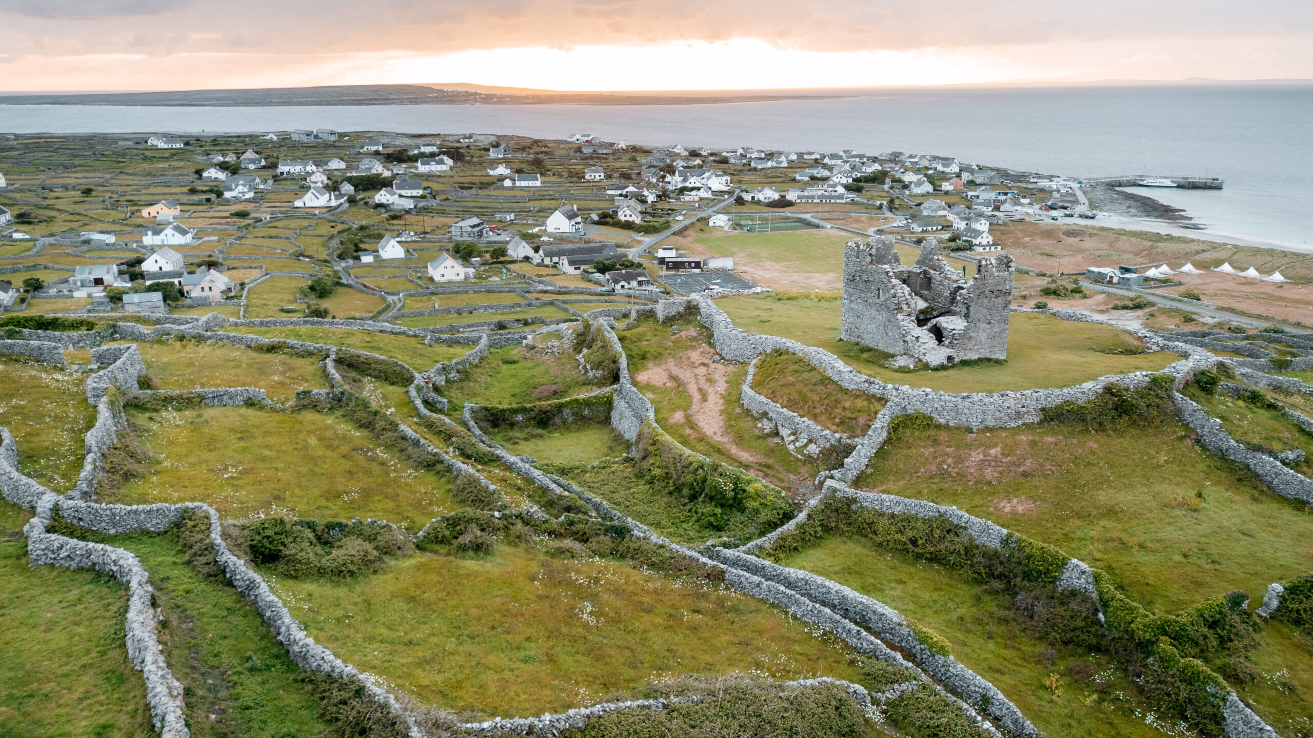 Sunset view over Inisheer village and stone walls – wild beauty of an Aran Islands wedding