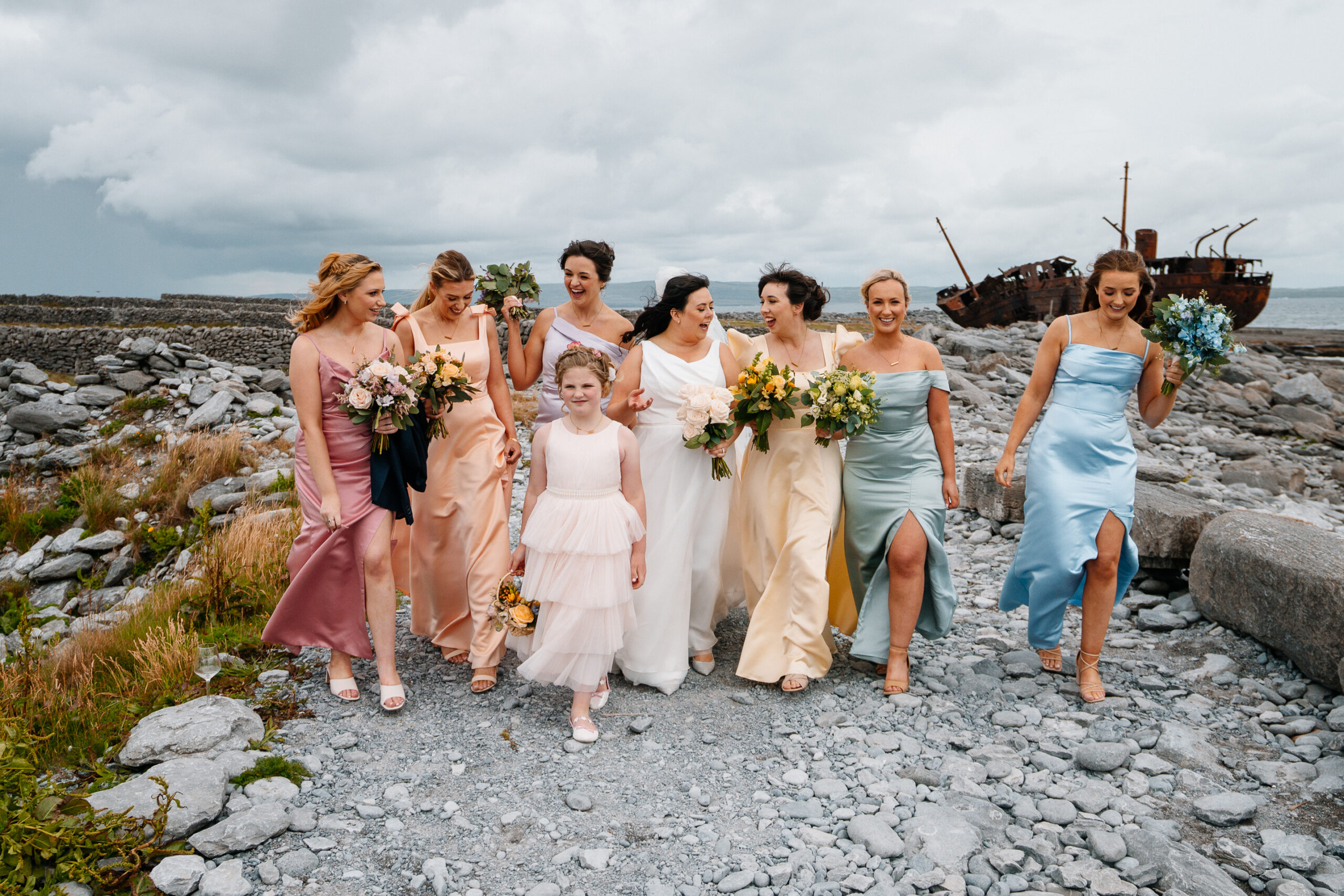 Bridesmaids running with bouquets near Plassey Shipwreck on Inisheer – Aran Islands wedding