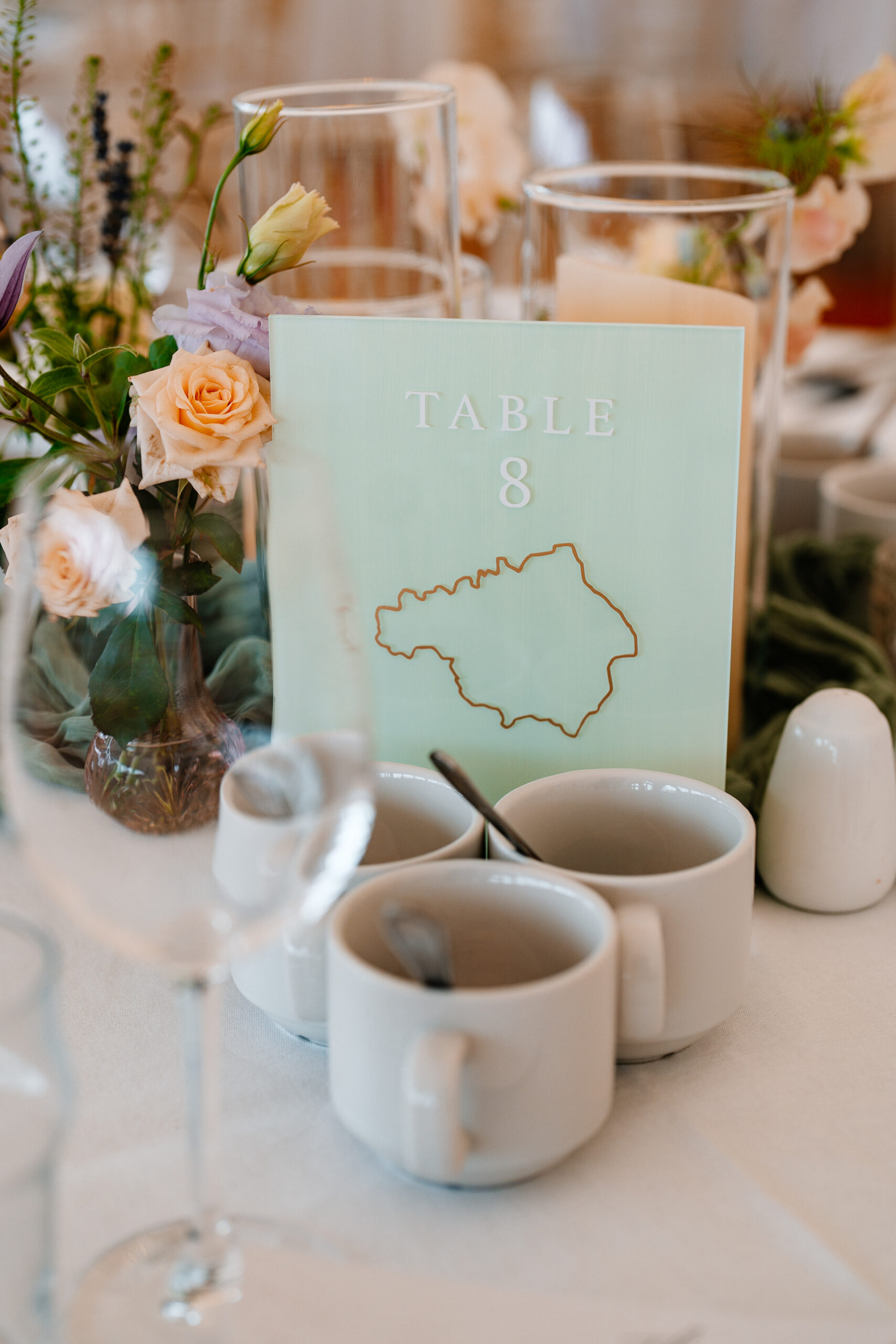 Elegant marquee wedding reception setup near Markree Castle with round tables and natural floral decor