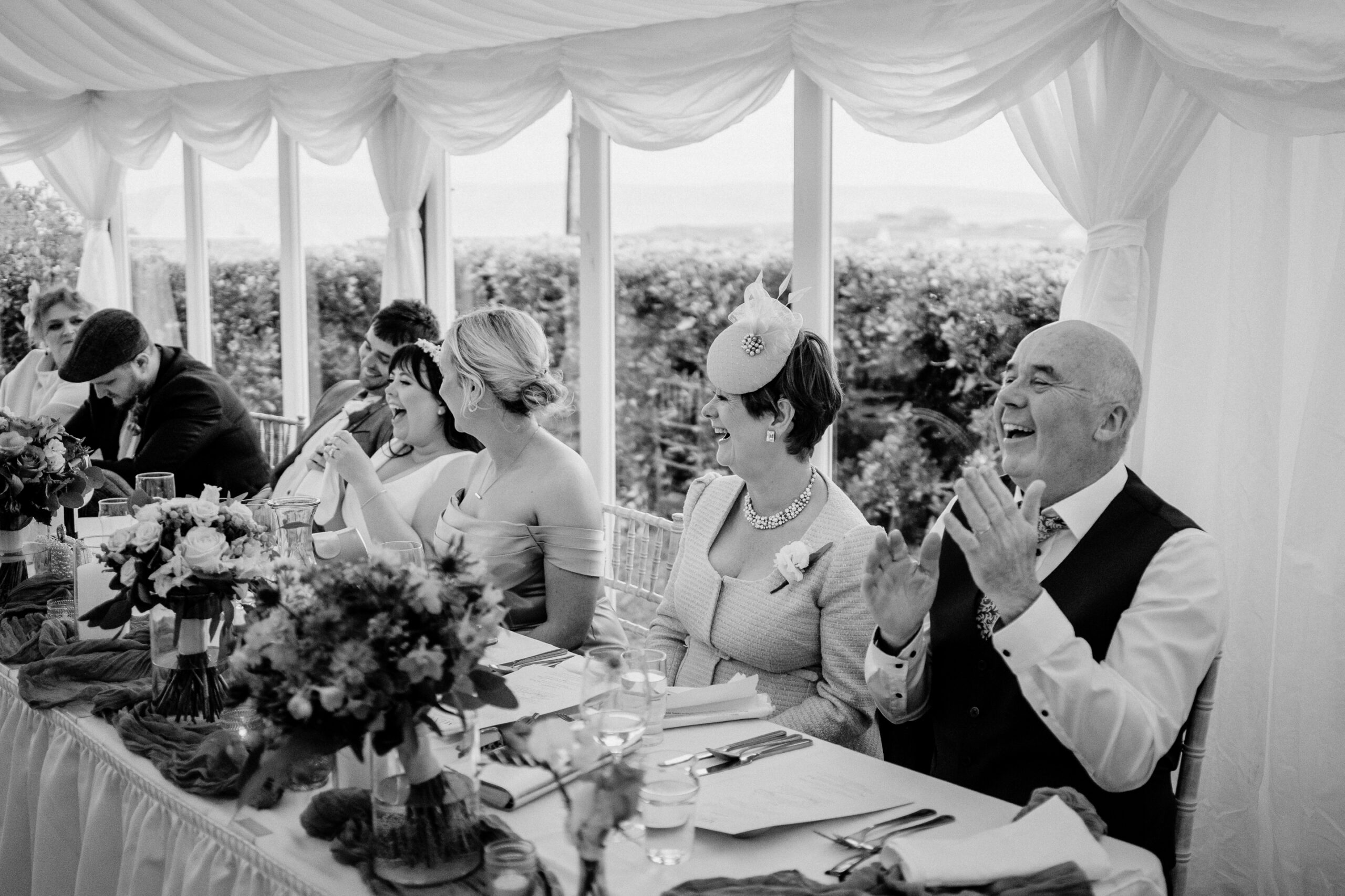 Wedding speeches during marquee reception near Markree Castle with natural light and guests’ reactions