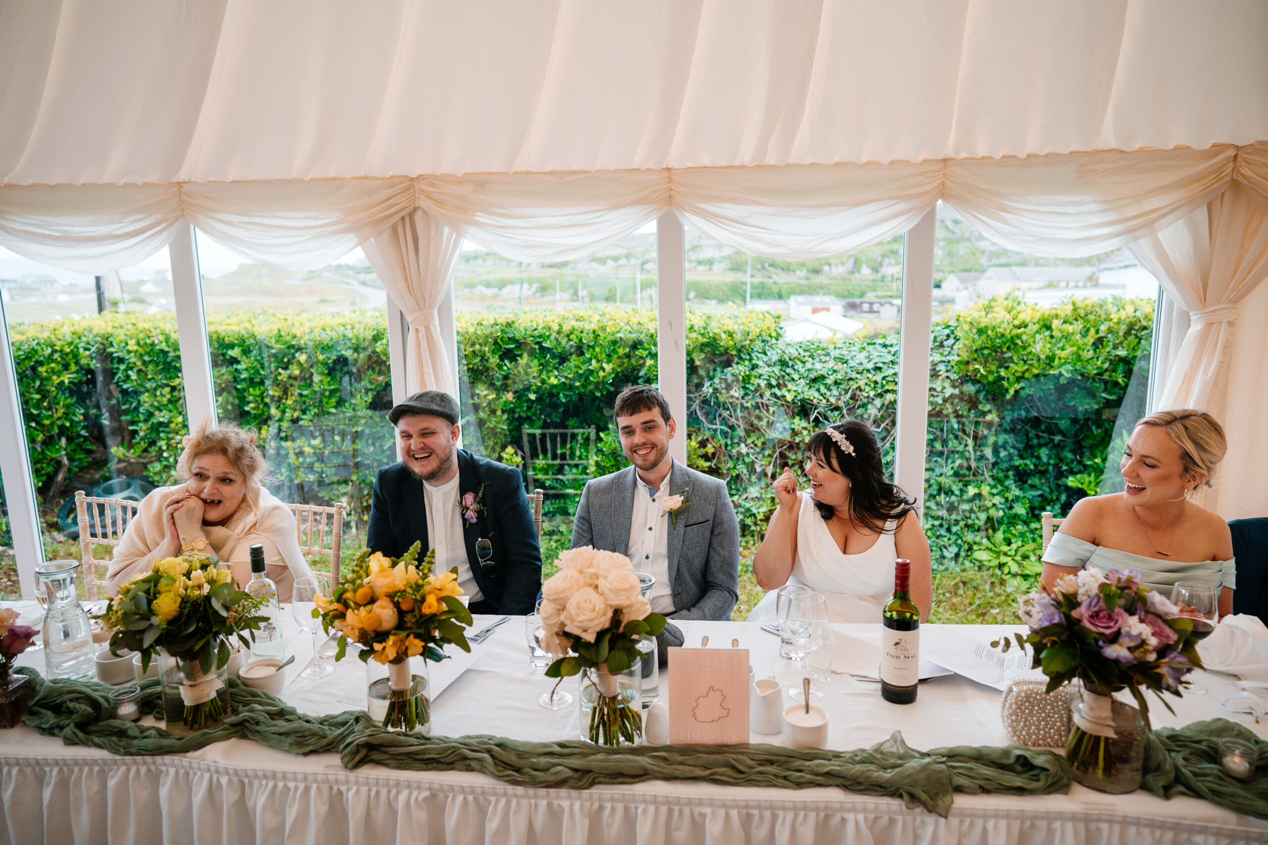 Wedding speeches during marquee reception near Markree Castle with natural light and guests’ reactions