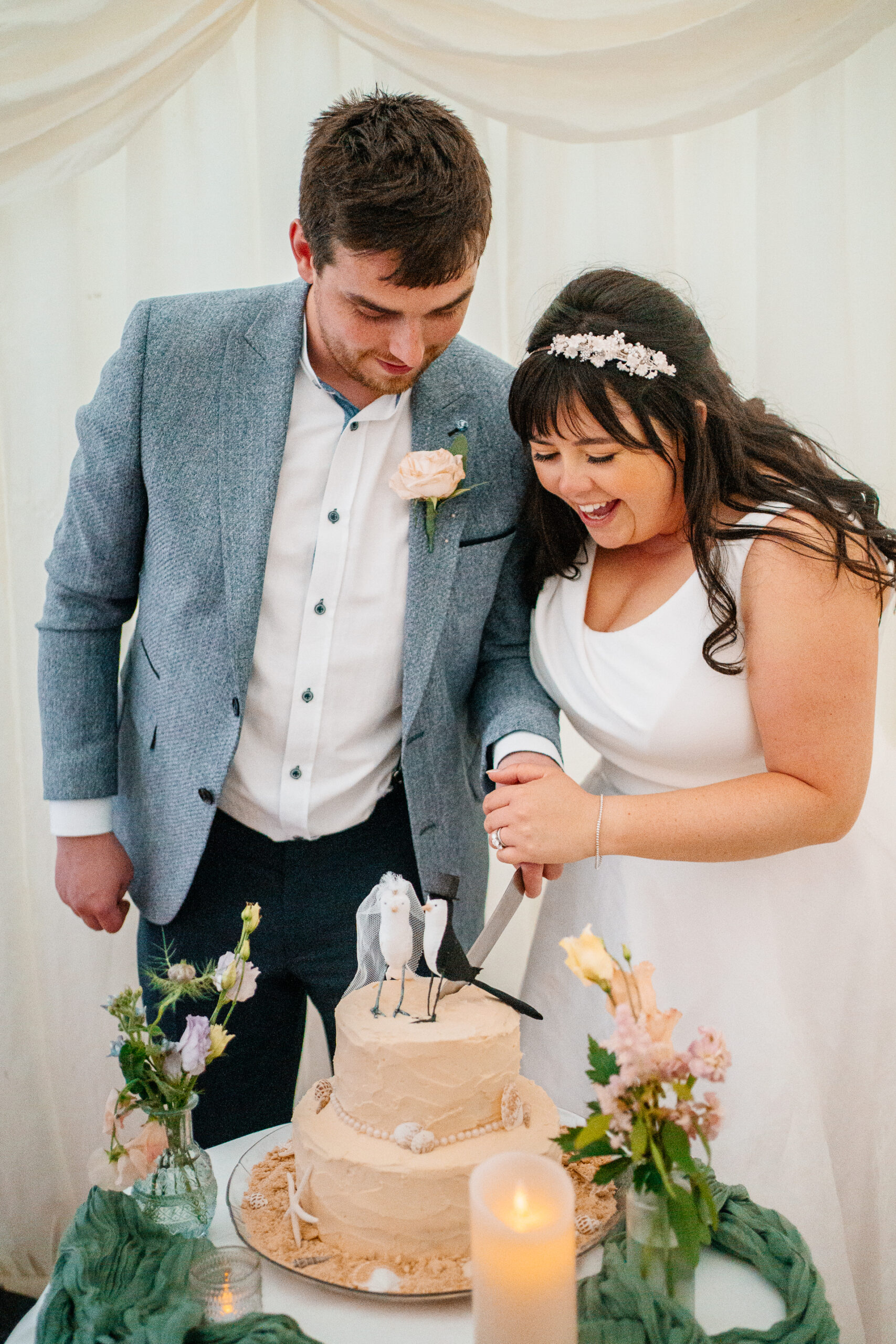 Bride and groom cutting their wedding cake during reception near Markree Castle