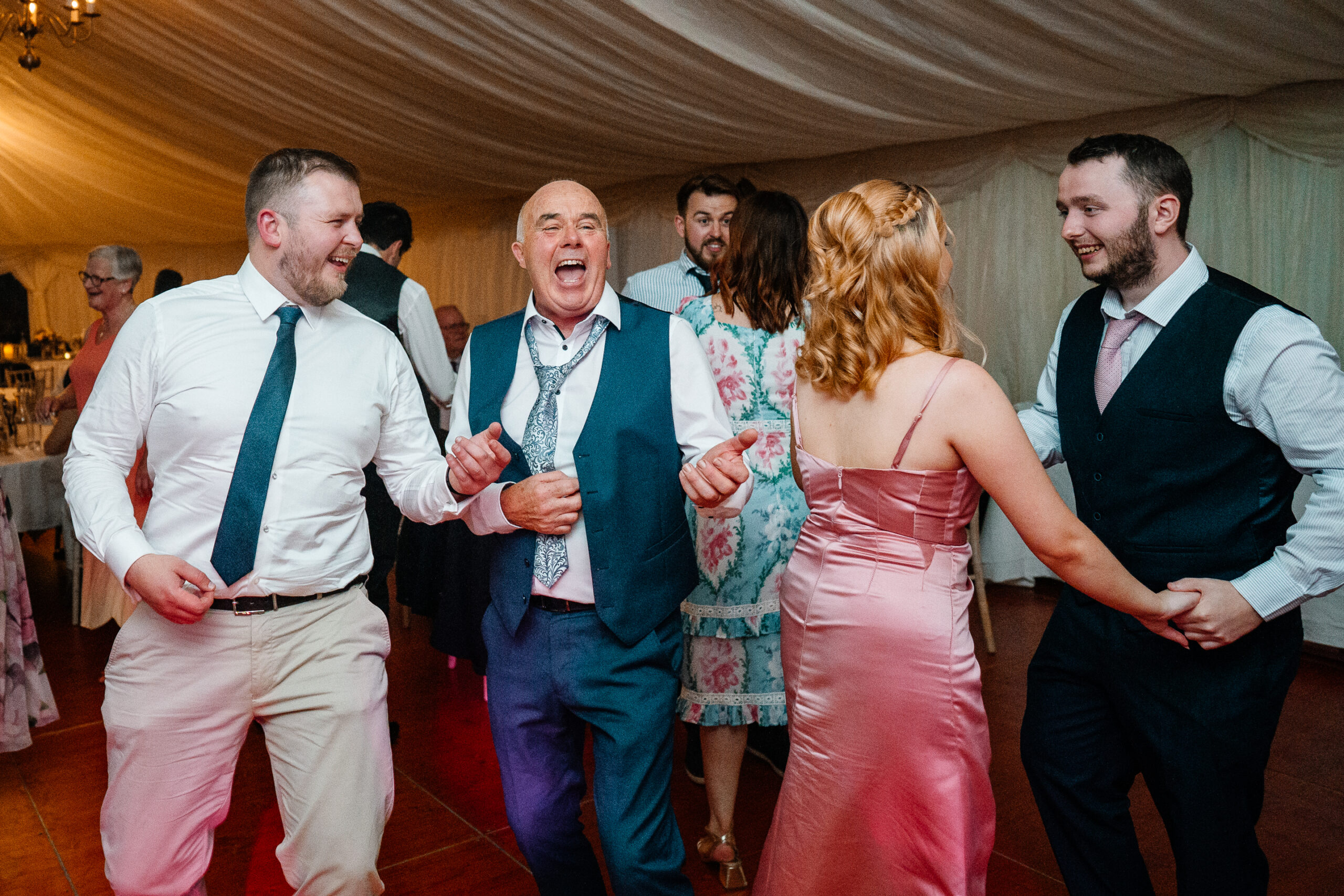 Guests dancing and celebrating on the wedding dancefloor near Markree Castle