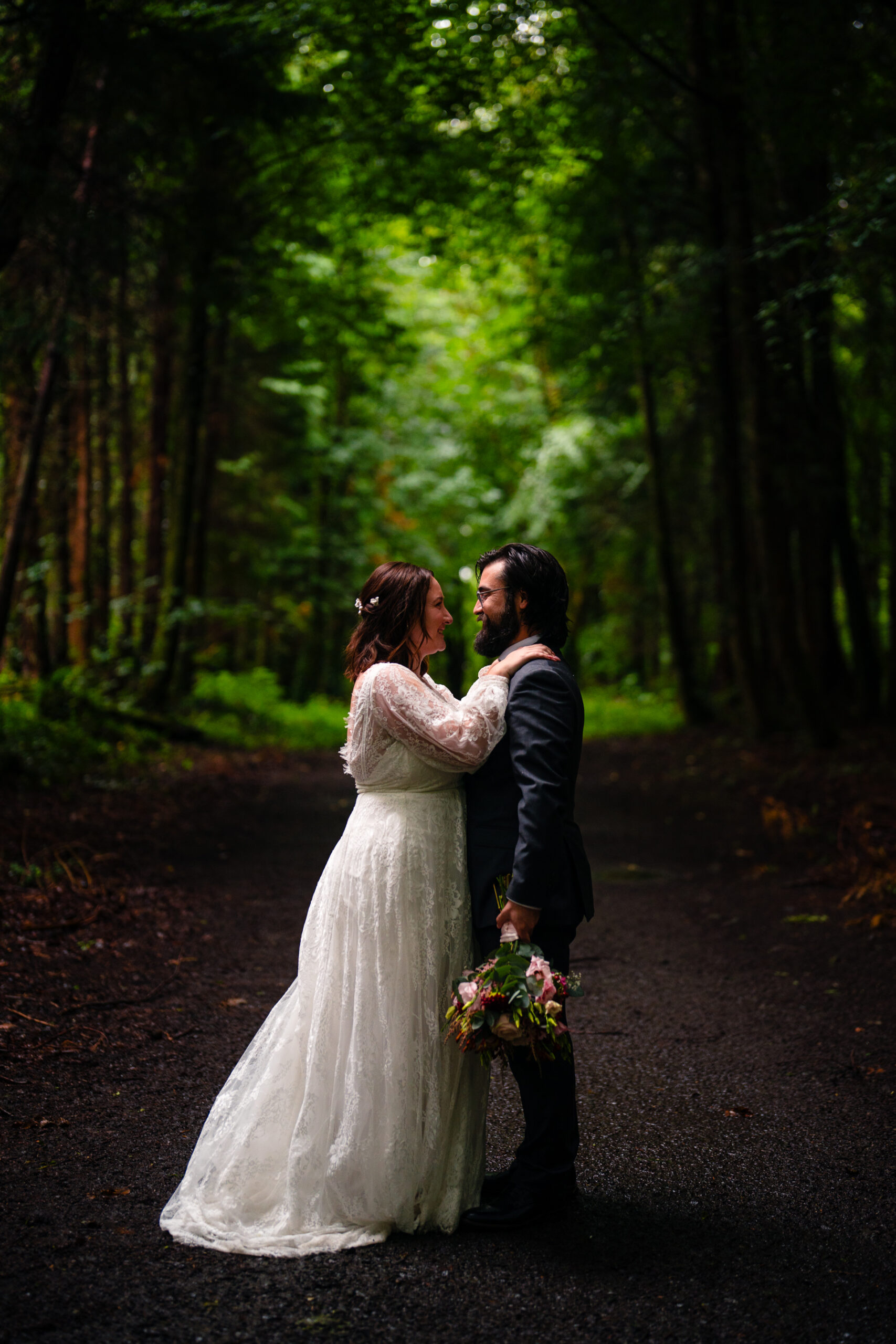 Romantic intimate wedding portrait in Belleek Woods and garden after rain