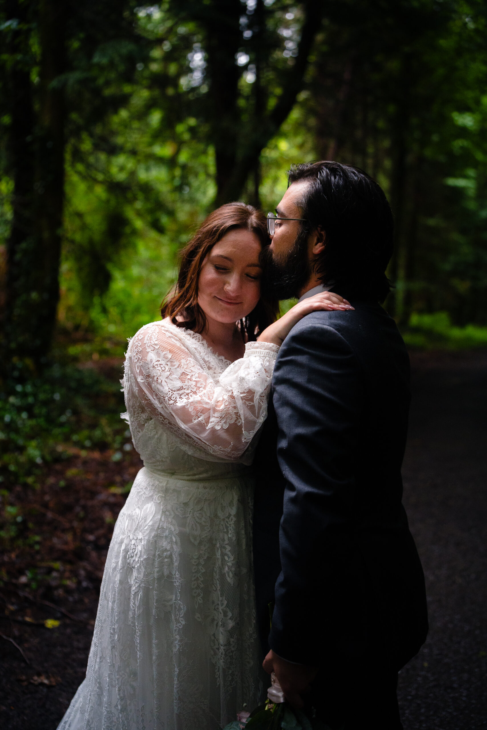 Romantic intimate wedding portrait in Belleek Woods and garden after rain