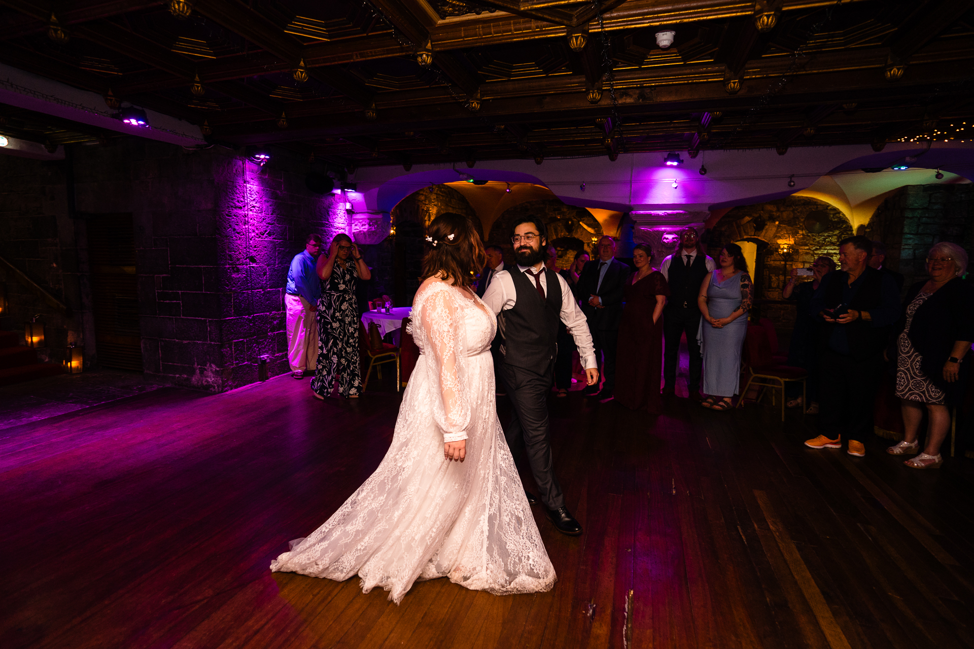 Couple’s first dance in historic ballroom at Belleek Castle during intimate destination wedding