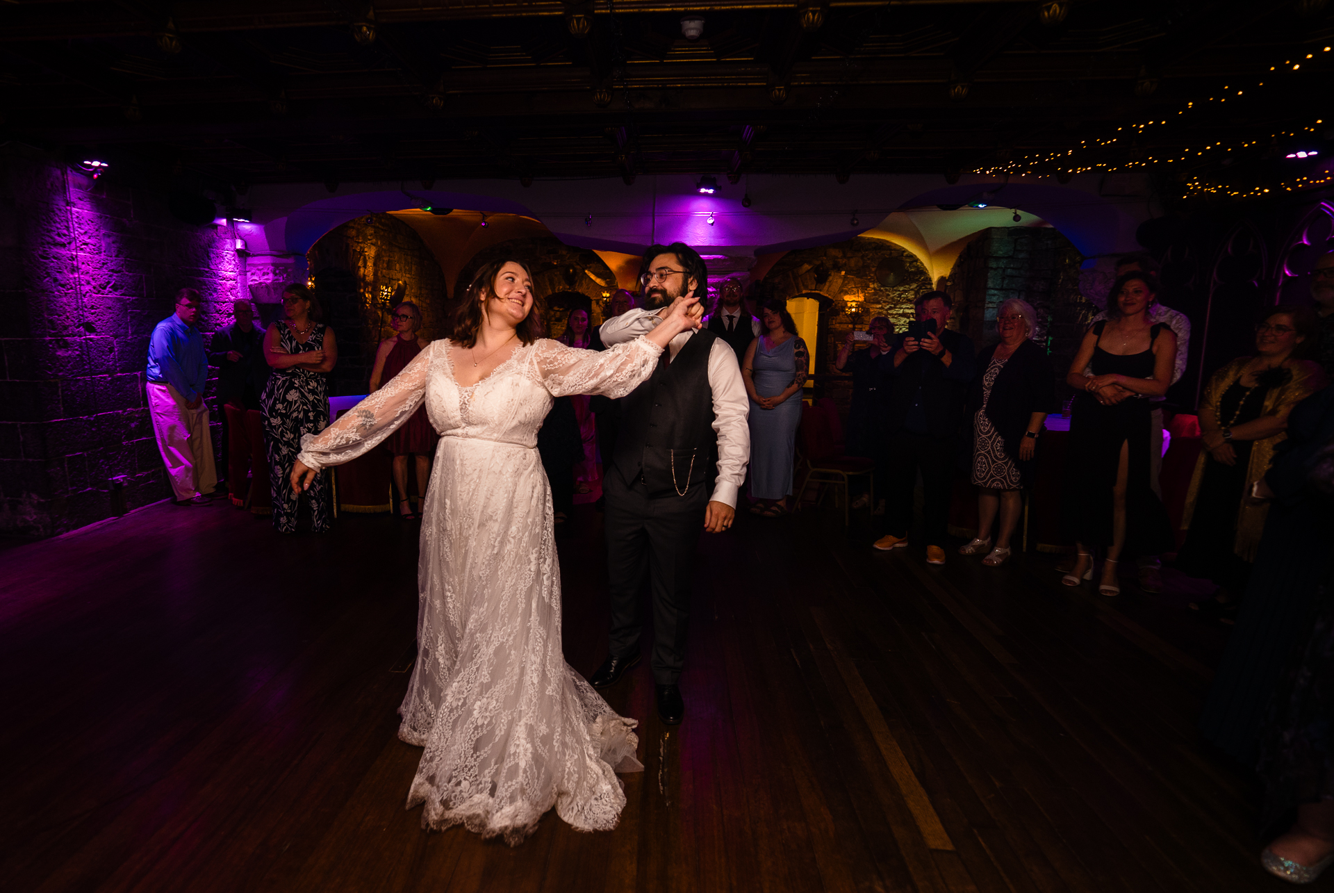Couple’s first dance in historic ballroom at Belleek Castle during intimate destination wedding