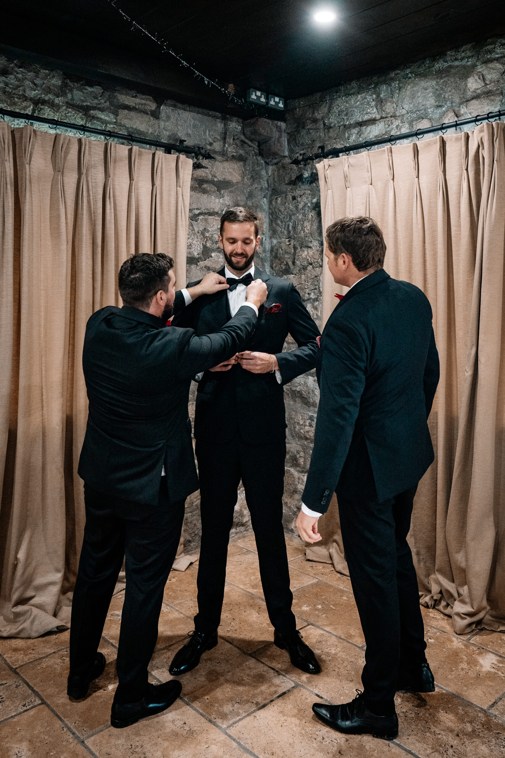 Groom getting ready at Cloghan Castle before his destination wedding