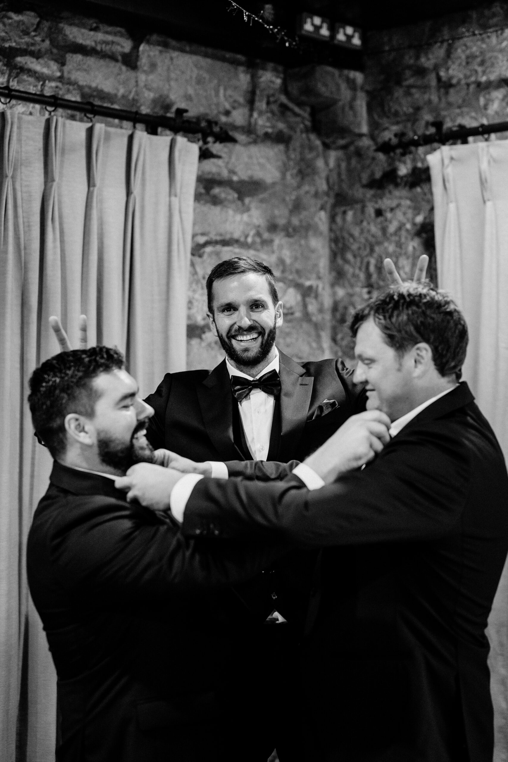 Candid moments of the groom preparing for the ceremony at Cloghan Castle