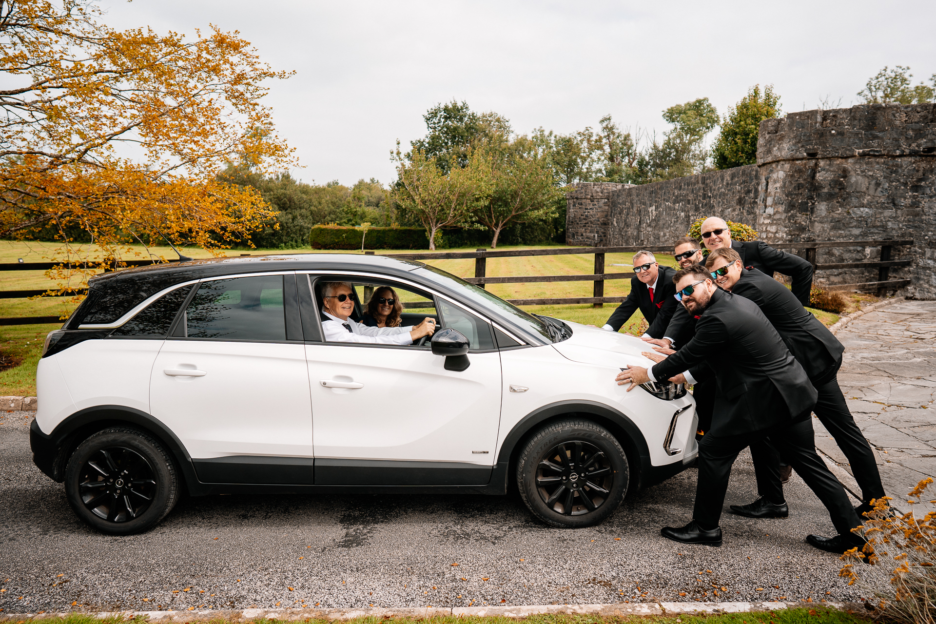 Documentary-style groom prep in the stylish interiors of Cloghan Castle