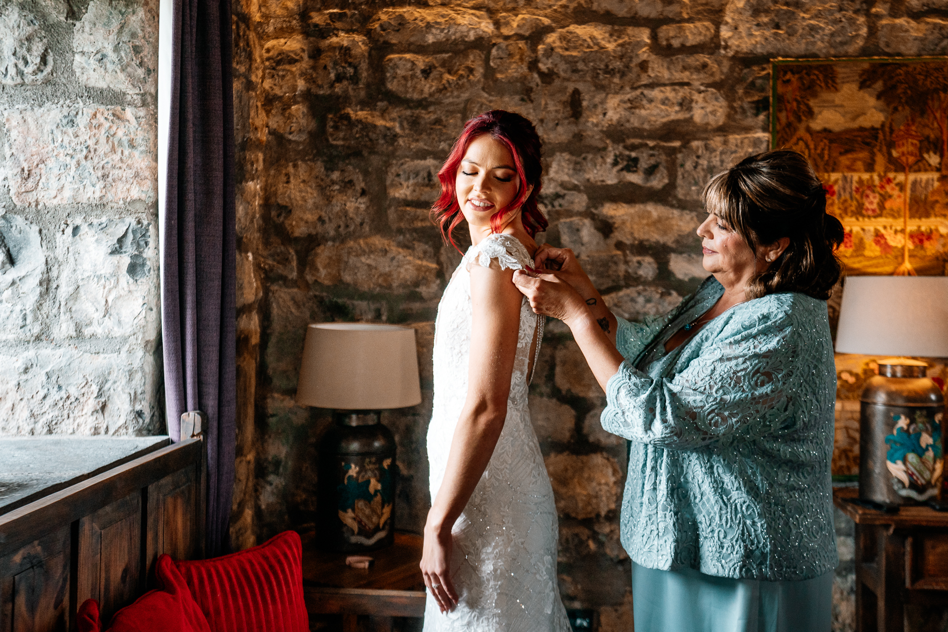 Bride getting ready in Cloghan Castle before her intimate destination wedding