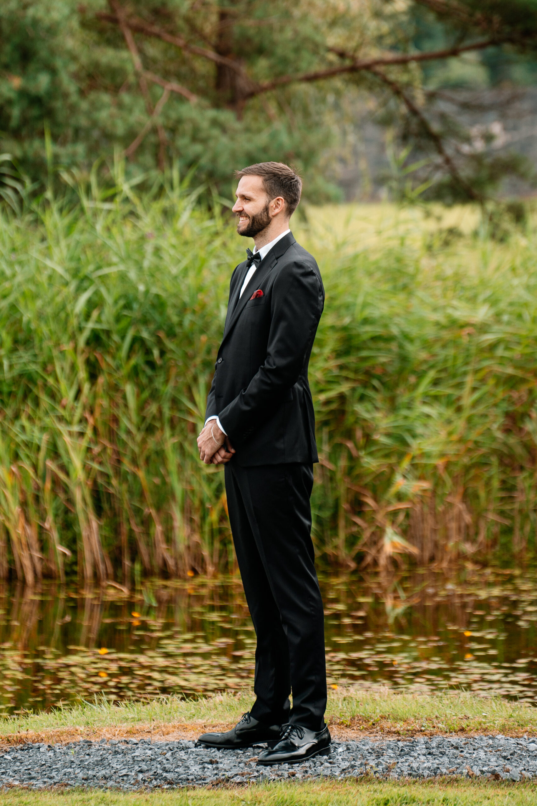 Bride and groom’s first look by the lake at Cloghan Castle