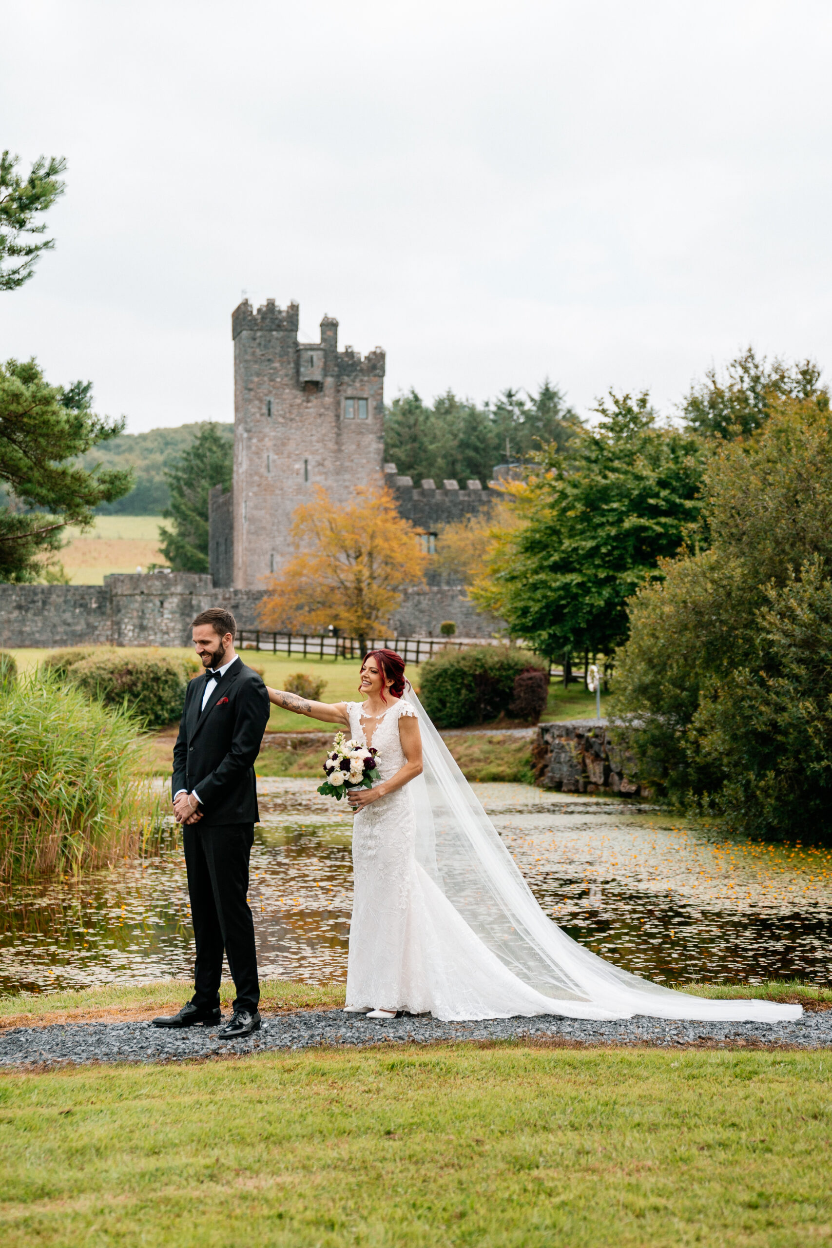 Bride and groom’s first look by the lake at Cloghan Castle