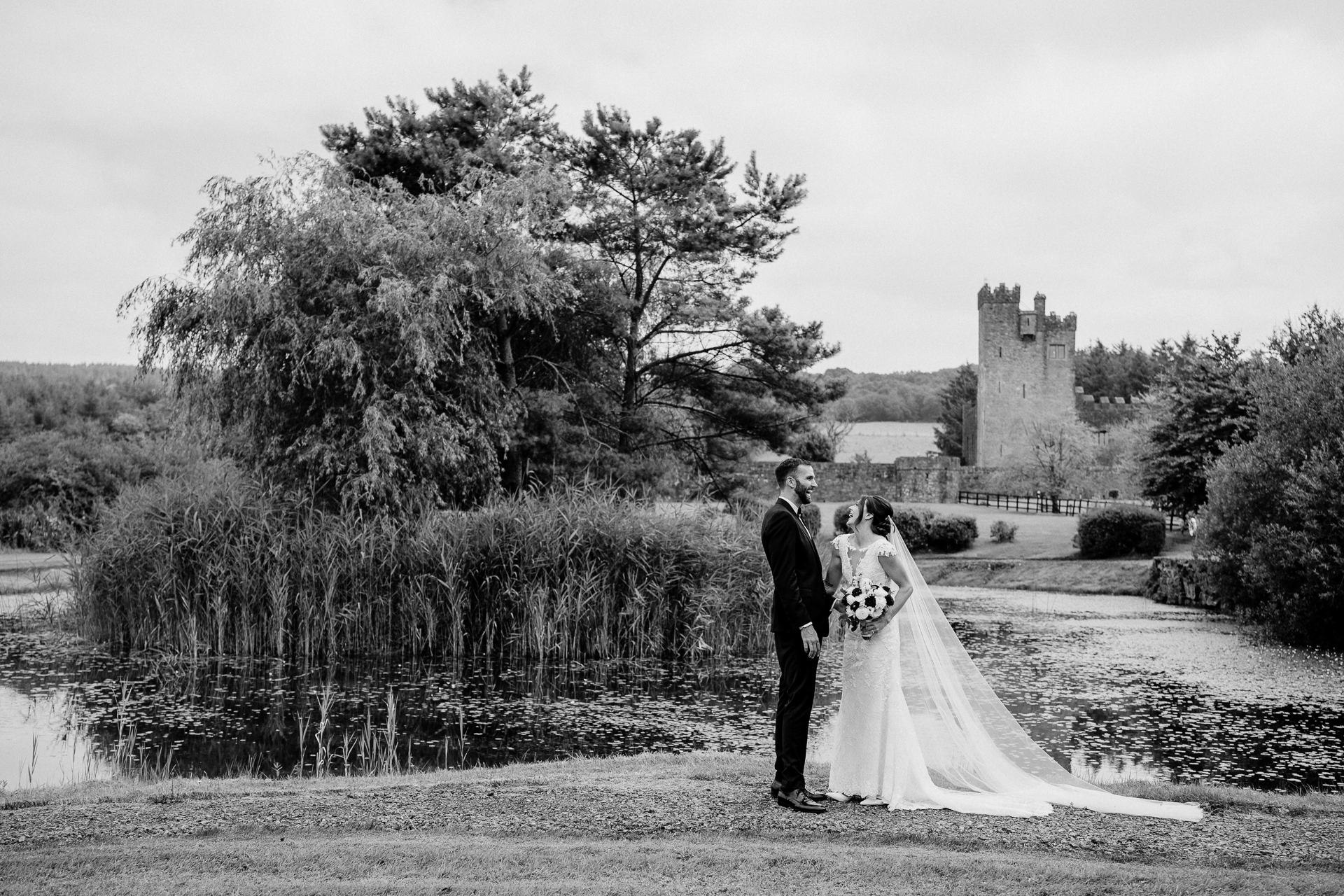 Bride and groom’s first look by the lake at Cloghan Castle