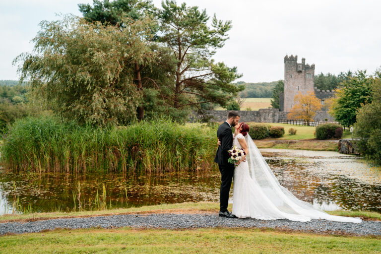 Bride and groom’s first look by the lake at Cloghan Castle