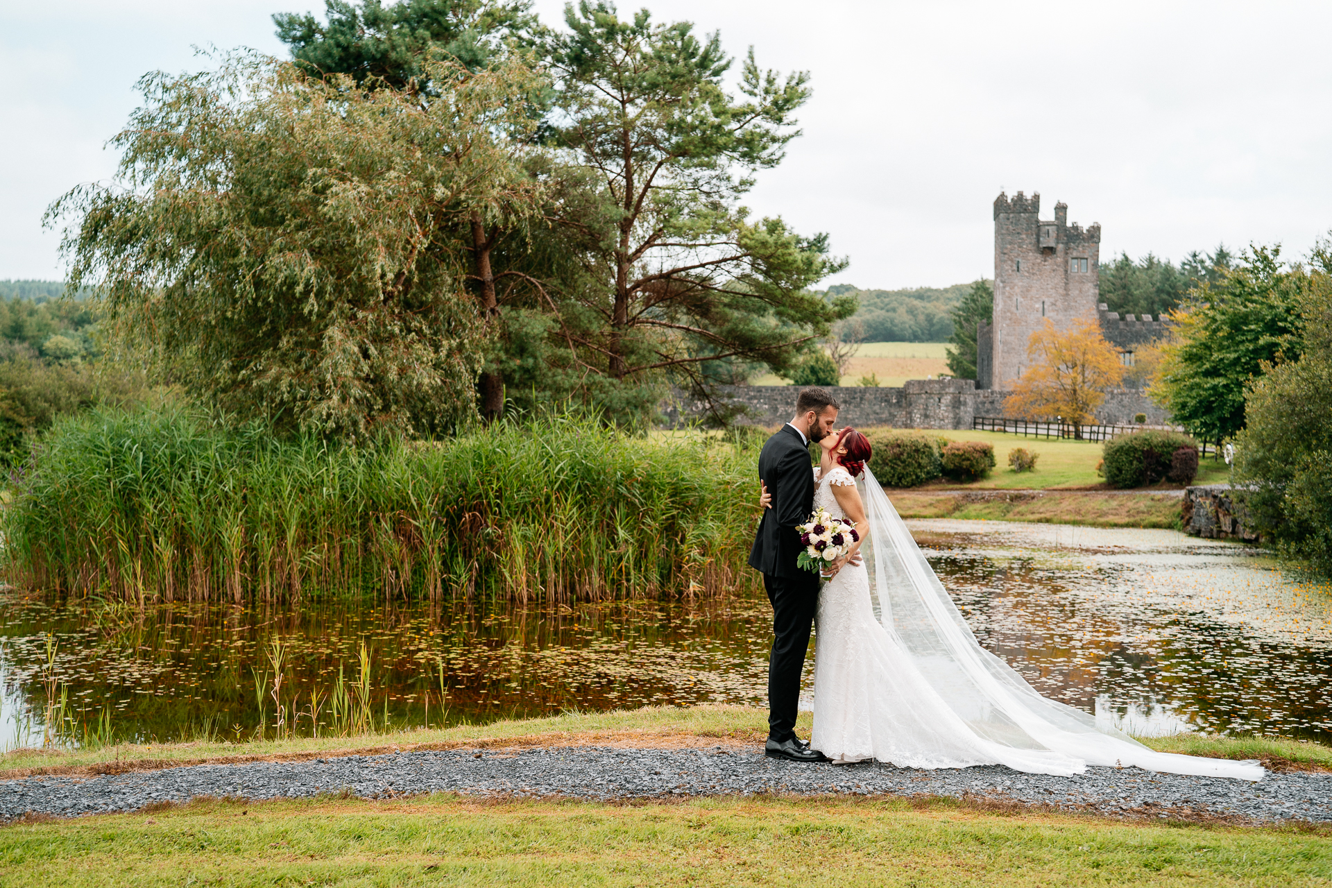Bride and groom’s first look by the lake at Cloghan Castle